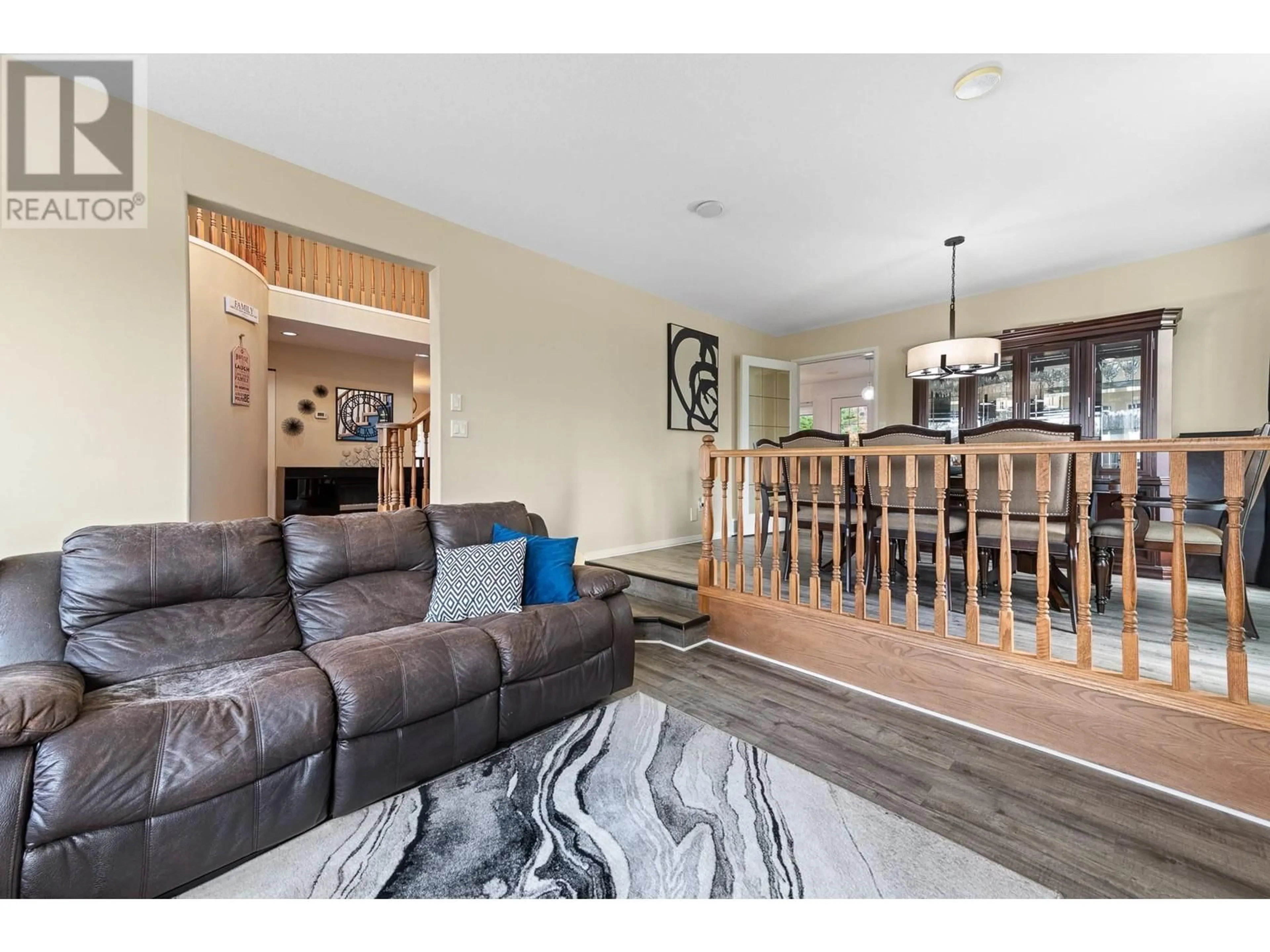 Living room with furniture, wood/laminate floor for 3257 JUNIPER Drive, Naramata British Columbia V0H1N1