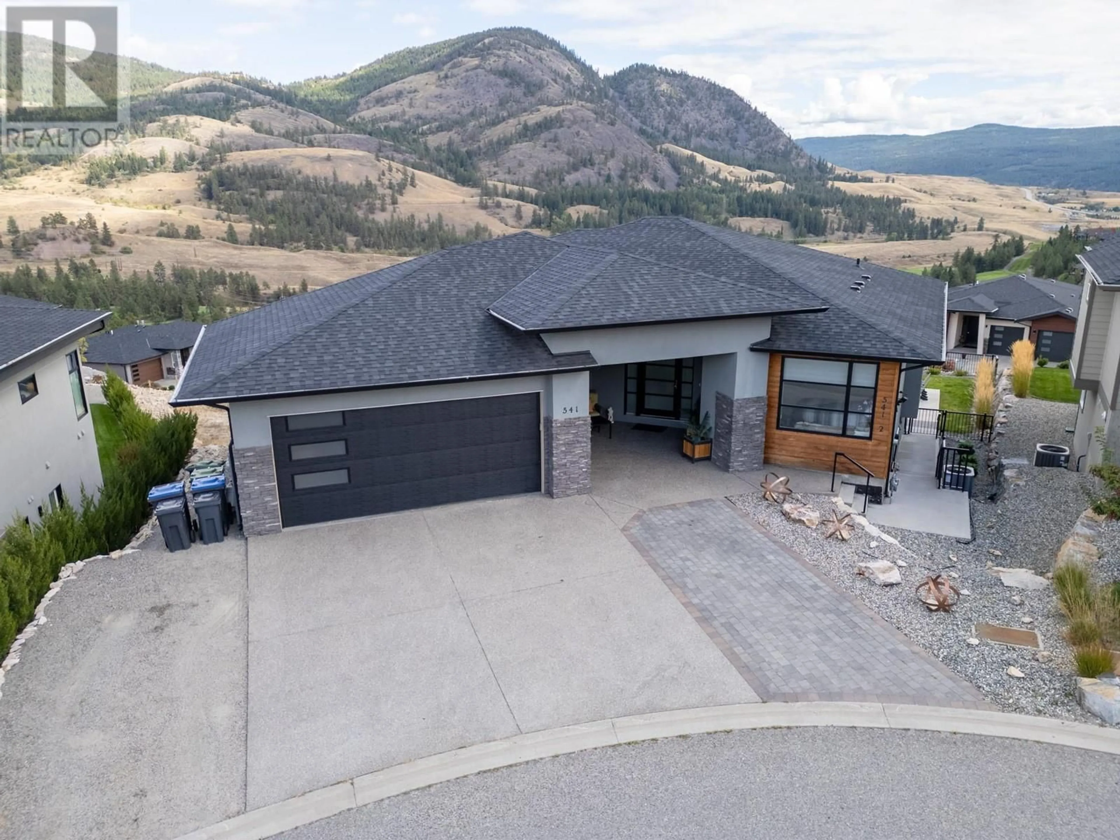 A pic from outside/outdoor area/front of a property/back of a property/a pic from drone, mountain view for 541 Barra Lane, Kelowna British Columbia V1P1T3