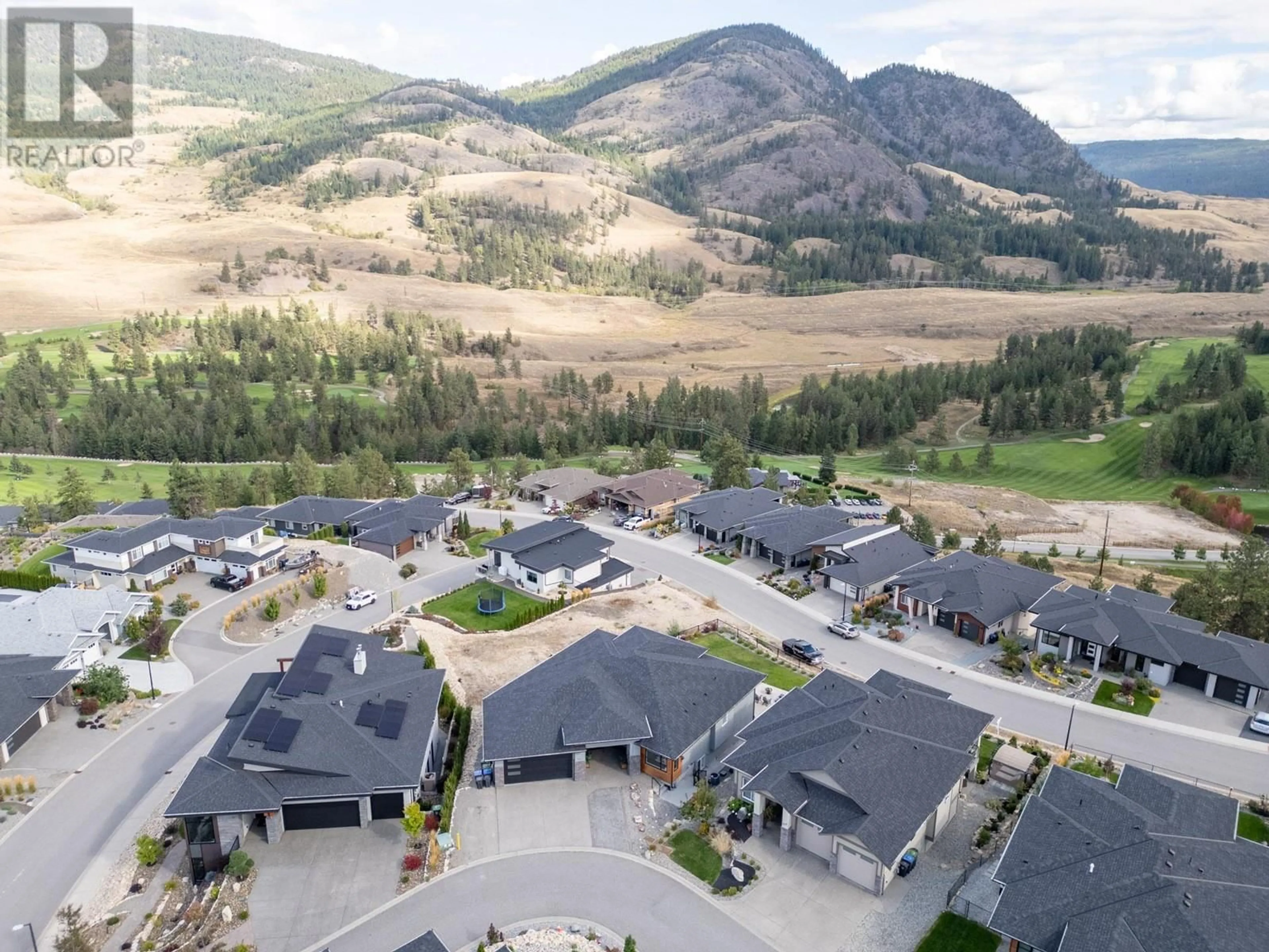 A pic from outside/outdoor area/front of a property/back of a property/a pic from drone, mountain view for 541 Barra Lane, Kelowna British Columbia V1P1T3