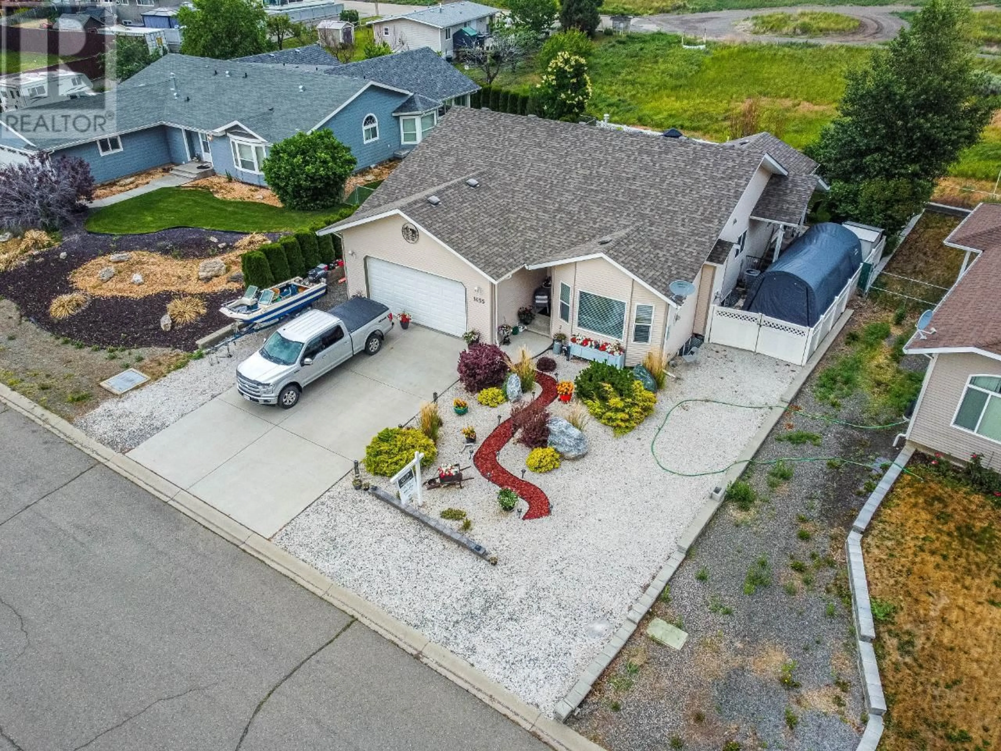 A pic from outside/outdoor area/front of a property/back of a property/a pic from drone, street for 1655 WOODBURN Drive, Cache Creek British Columbia V0K1H0