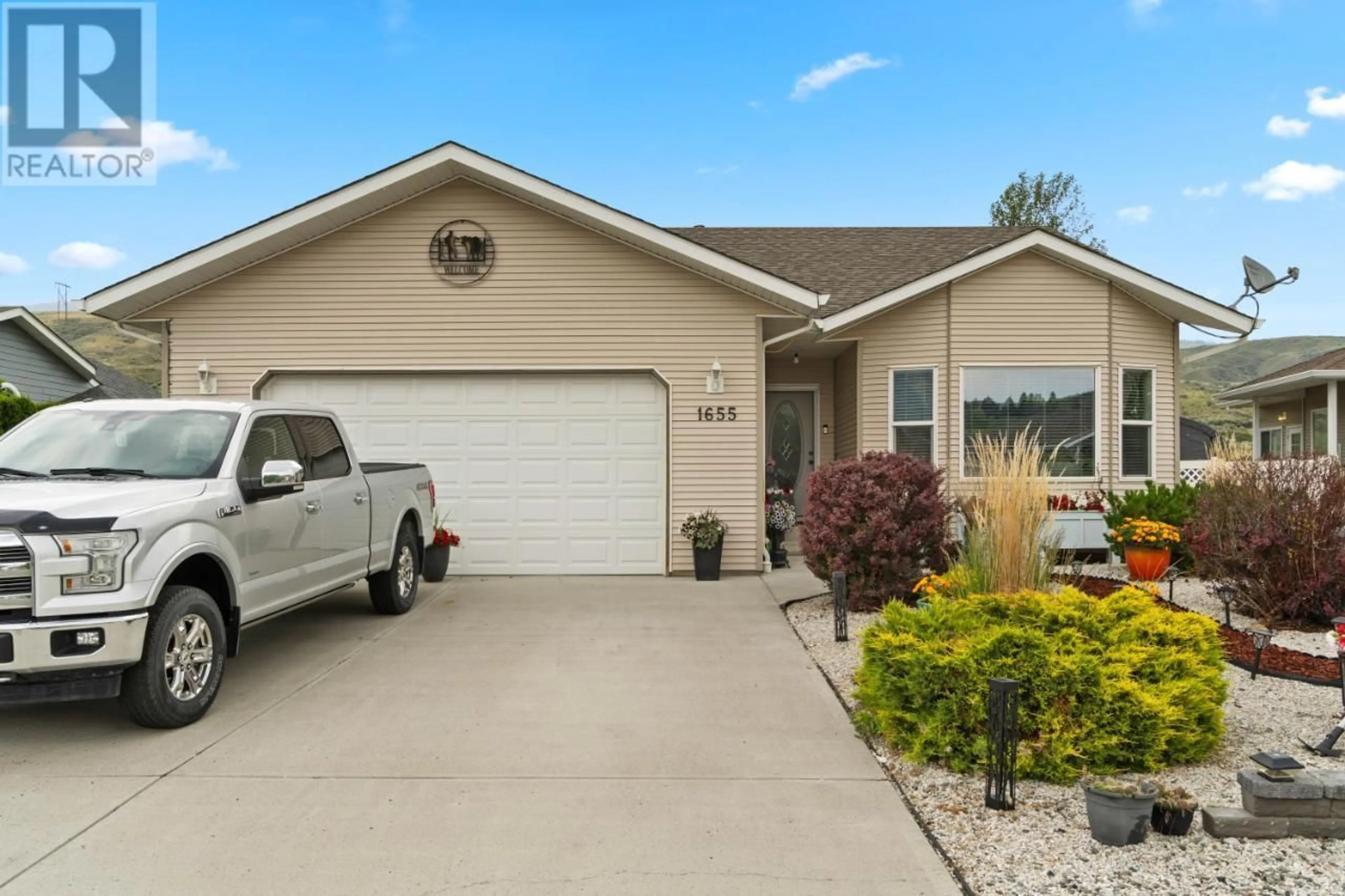 Home with vinyl exterior material, street for 1655 WOODBURN Drive, Cache Creek British Columbia V0K1H0