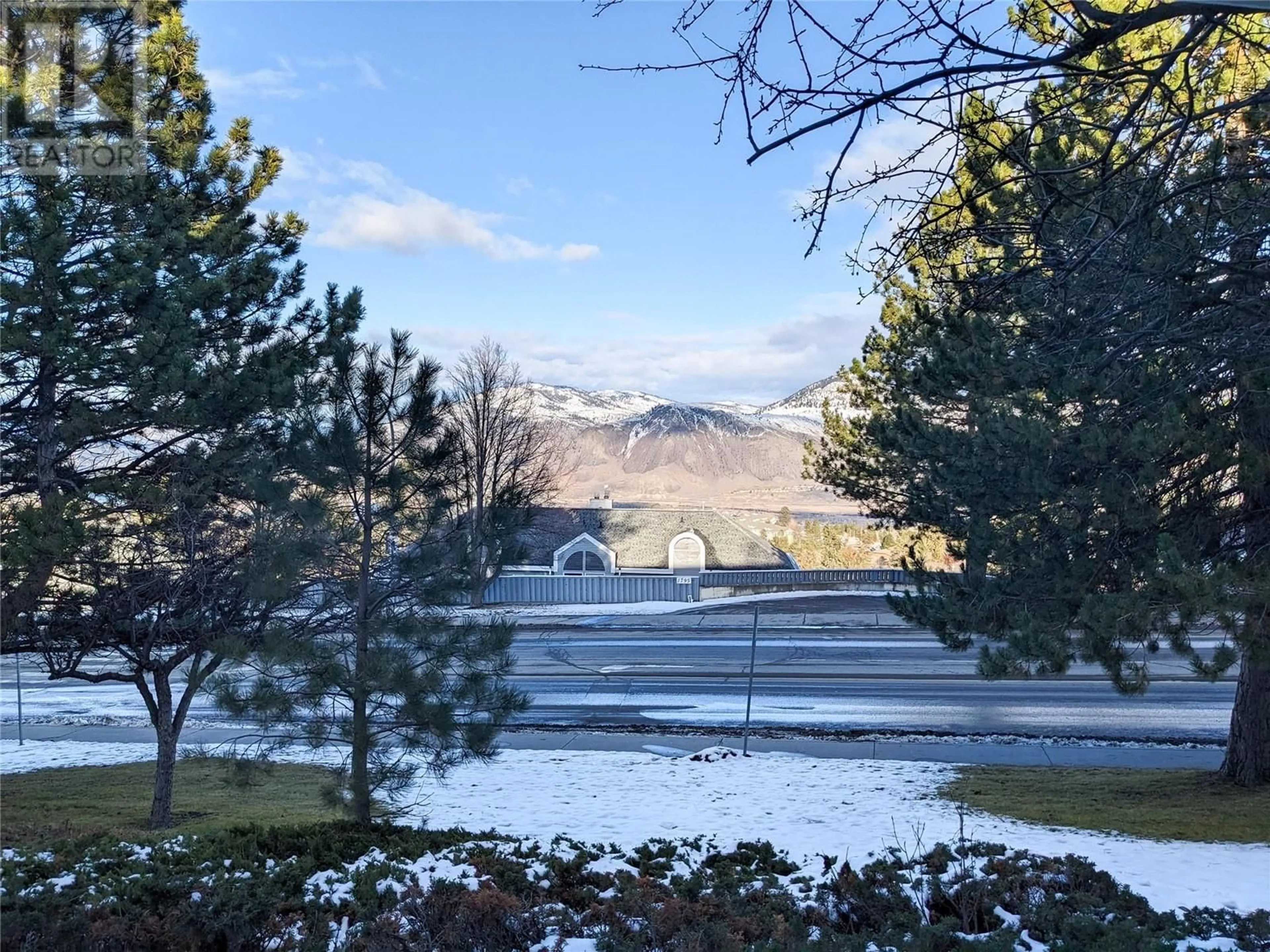 A pic from outside/outdoor area/front of a property/back of a property/a pic from drone, mountain view for 1810 SUMMIT Drive Unit# 2, Kamloops British Columbia V2E2C7