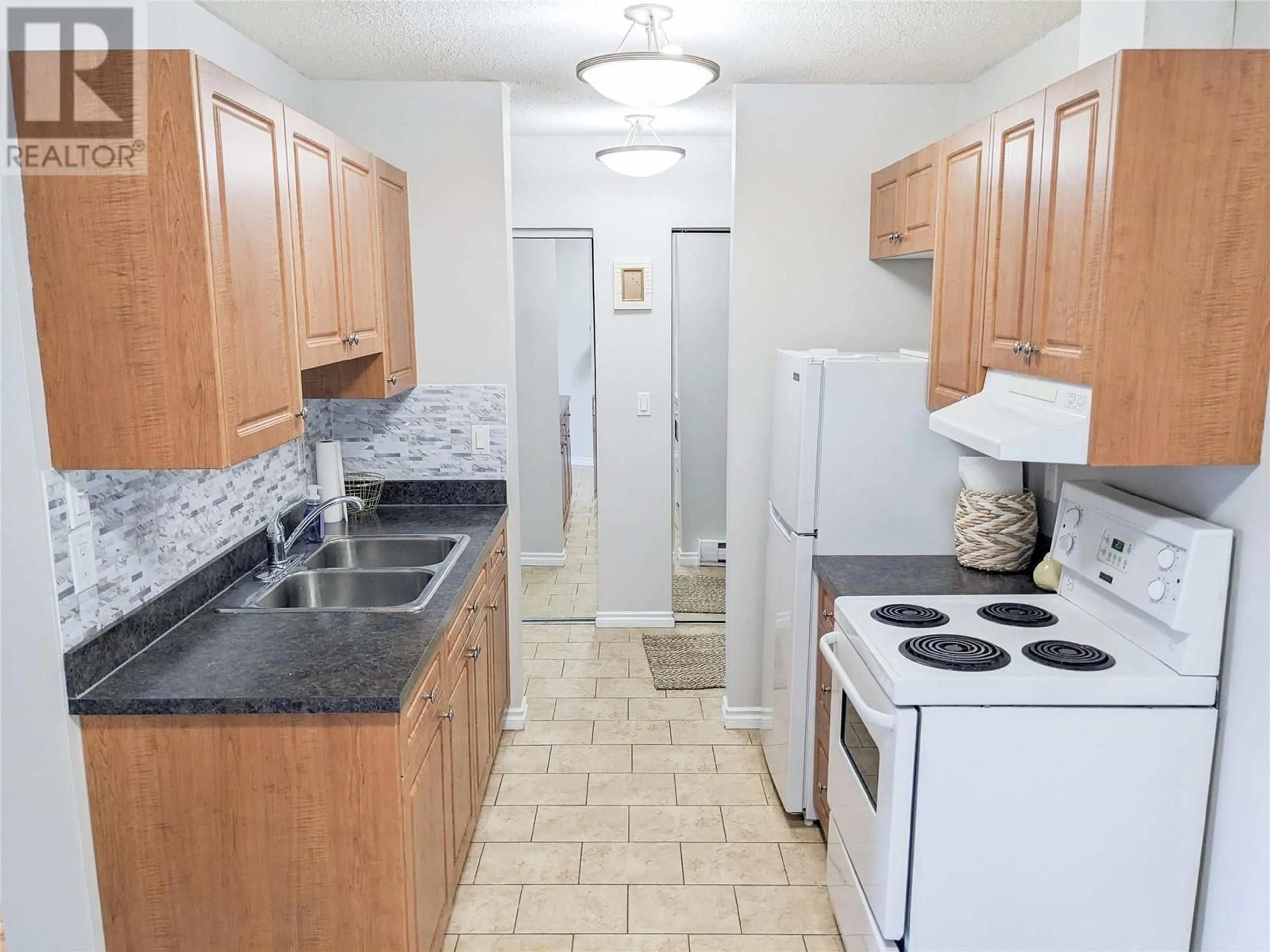 Standard kitchen, ceramic/tile floor for 1810 SUMMIT Drive Unit# 2, Kamloops British Columbia V2E2C7