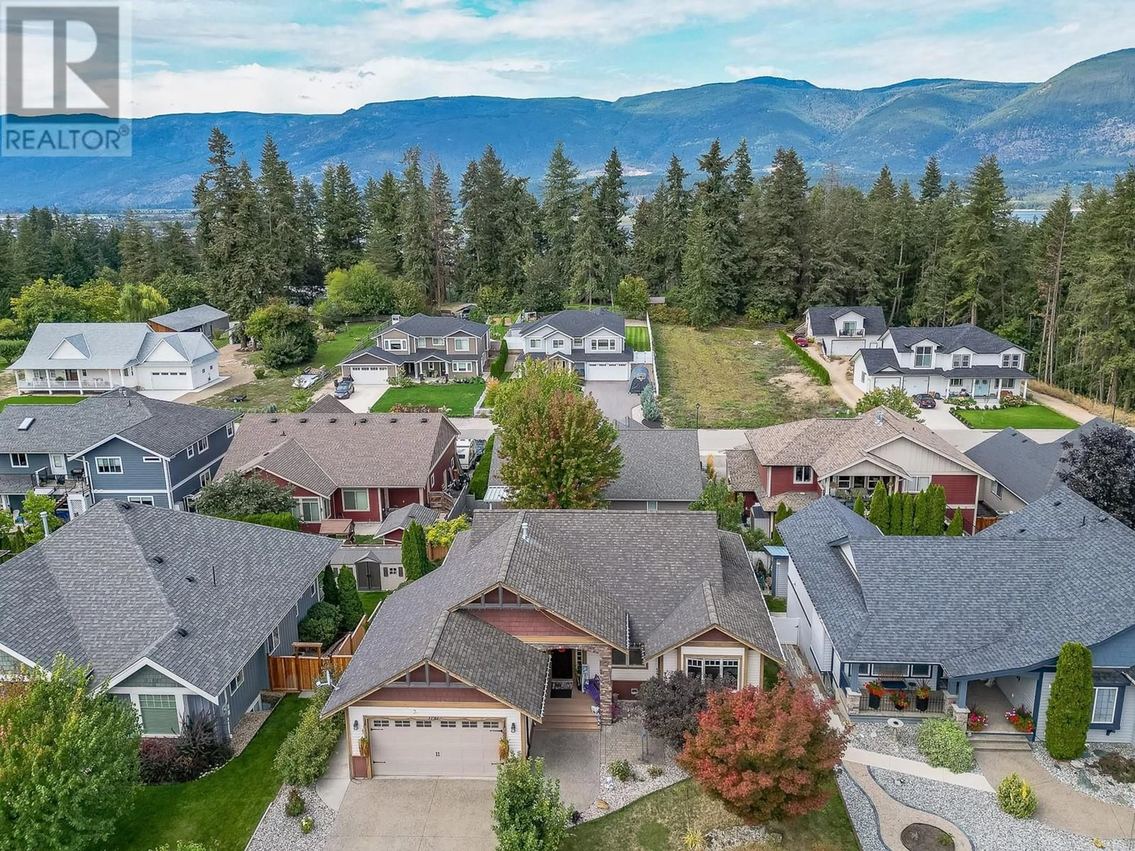 A pic from outside/outdoor area/front of a property/back of a property/a pic from drone, mountain view for 1791 23 Street NE, Salmon Arm British Columbia V1E3M6