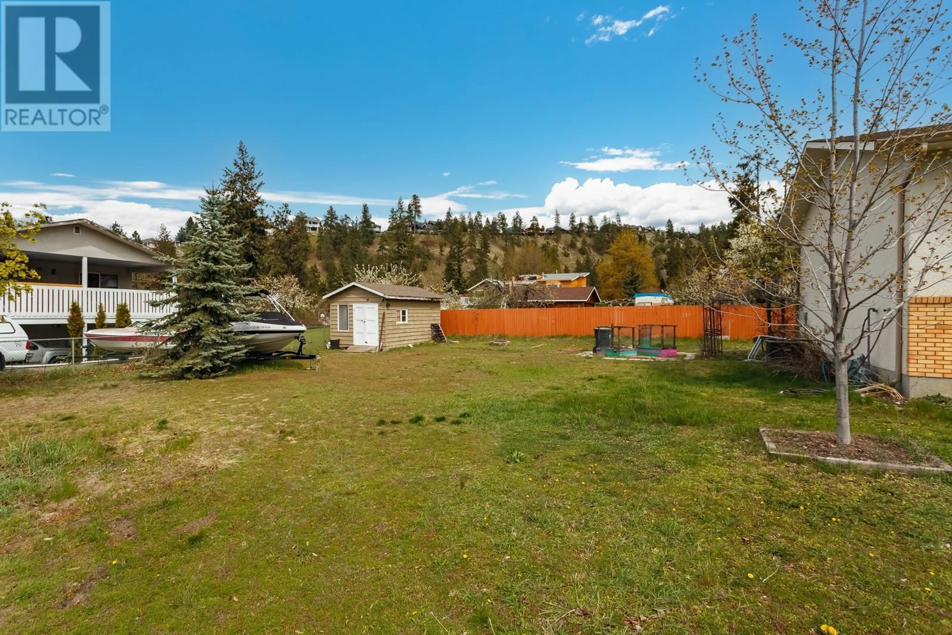 A pic from outside/outdoor area/front of a property/back of a property/a pic from drone, forest/trees view for 4493 Wasilow Road, Kelowna British Columbia V1W1R7