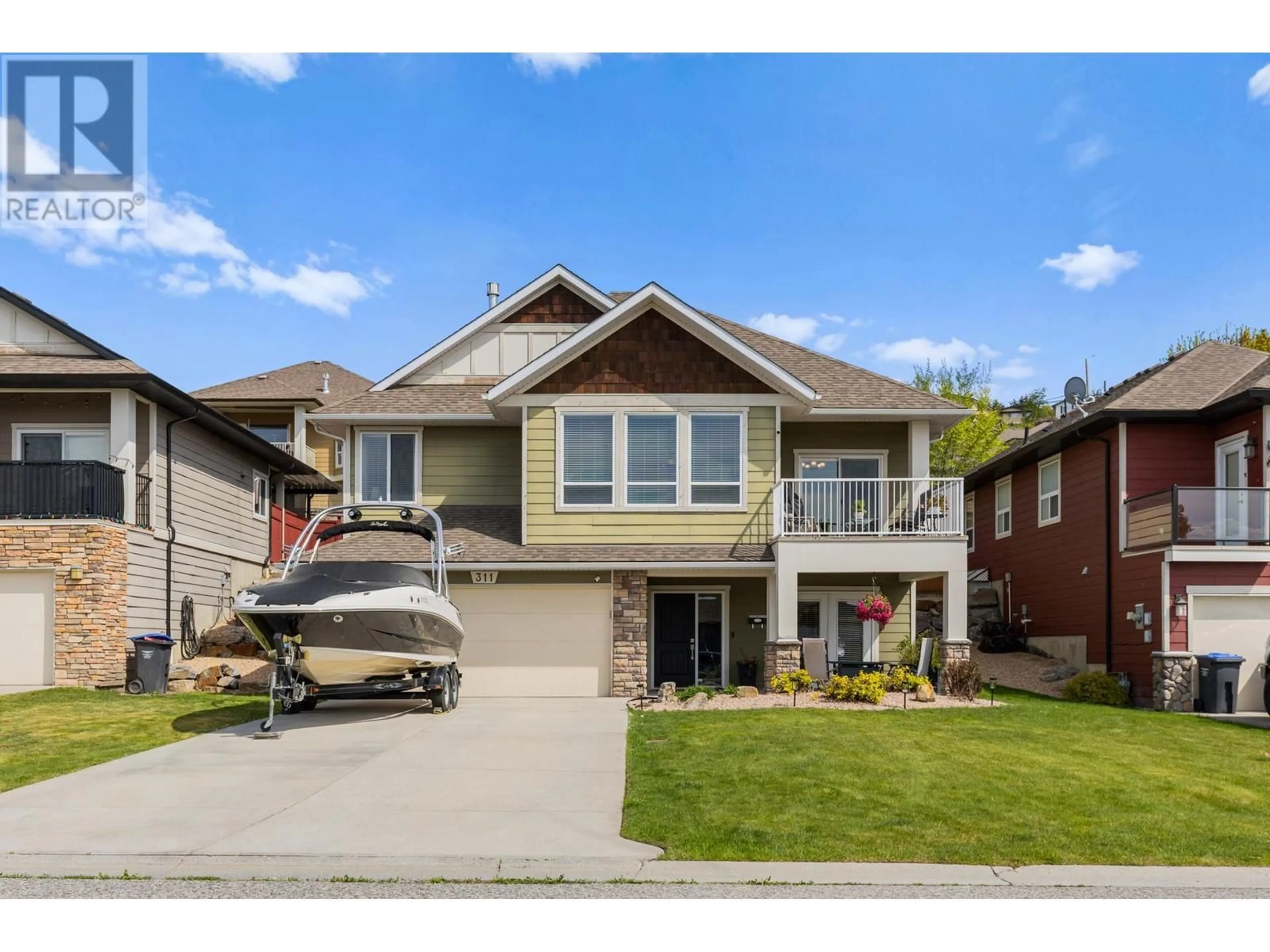 Home with vinyl exterior material, street for 311 POONIAN STREET, Kelowna British Columbia V1X8C3