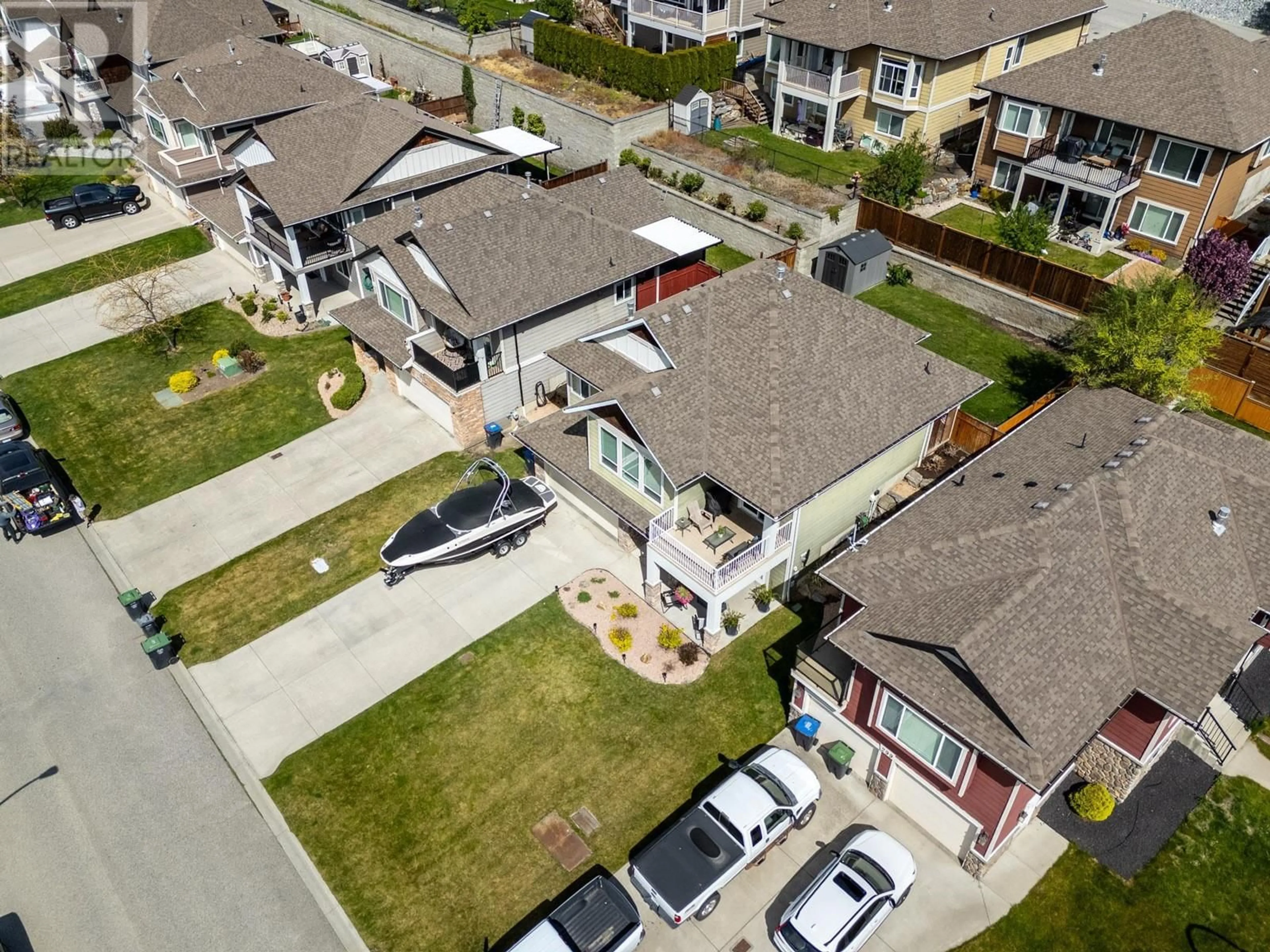 A pic from outside/outdoor area/front of a property/back of a property/a pic from drone, street for 311 POONIAN STREET, Kelowna British Columbia V1X8C3
