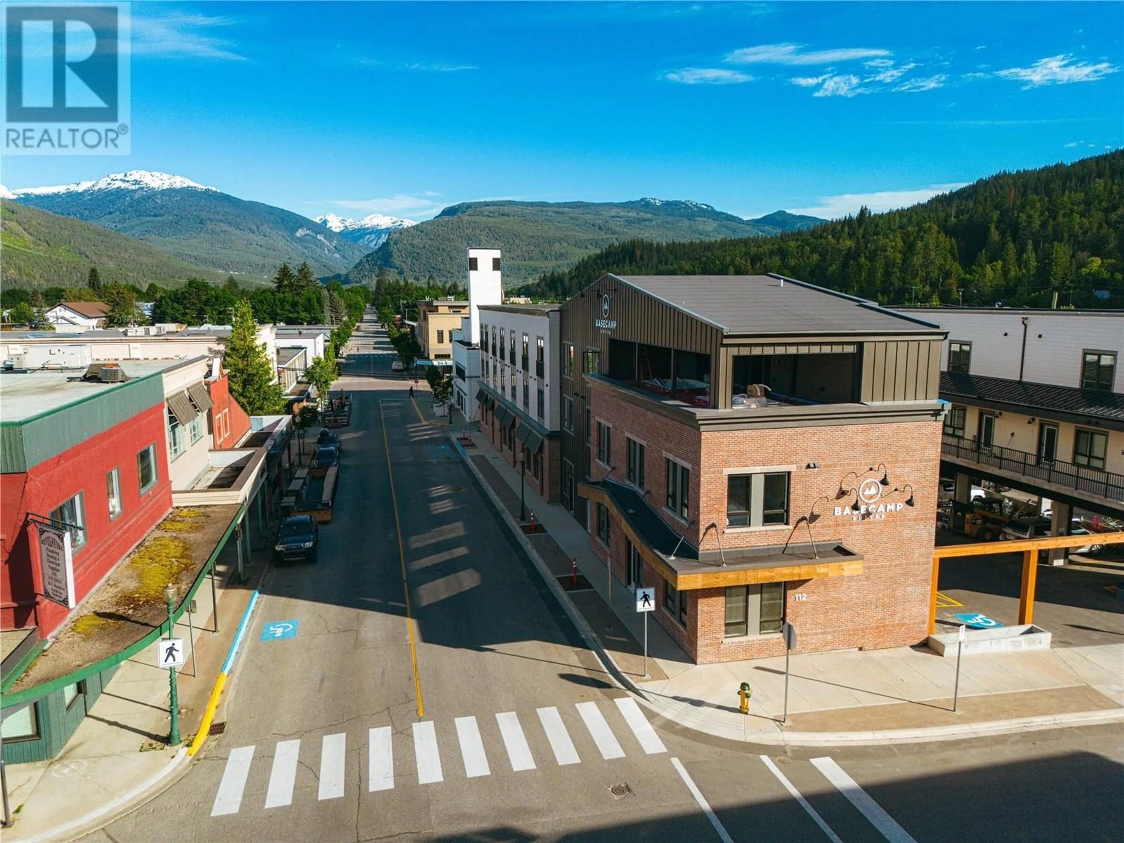 A pic from outside/outdoor area/front of a property/back of a property/a pic from drone, mountain view for 112 Second Street E Unit# 104, Revelstoke British Columbia V0E2S0