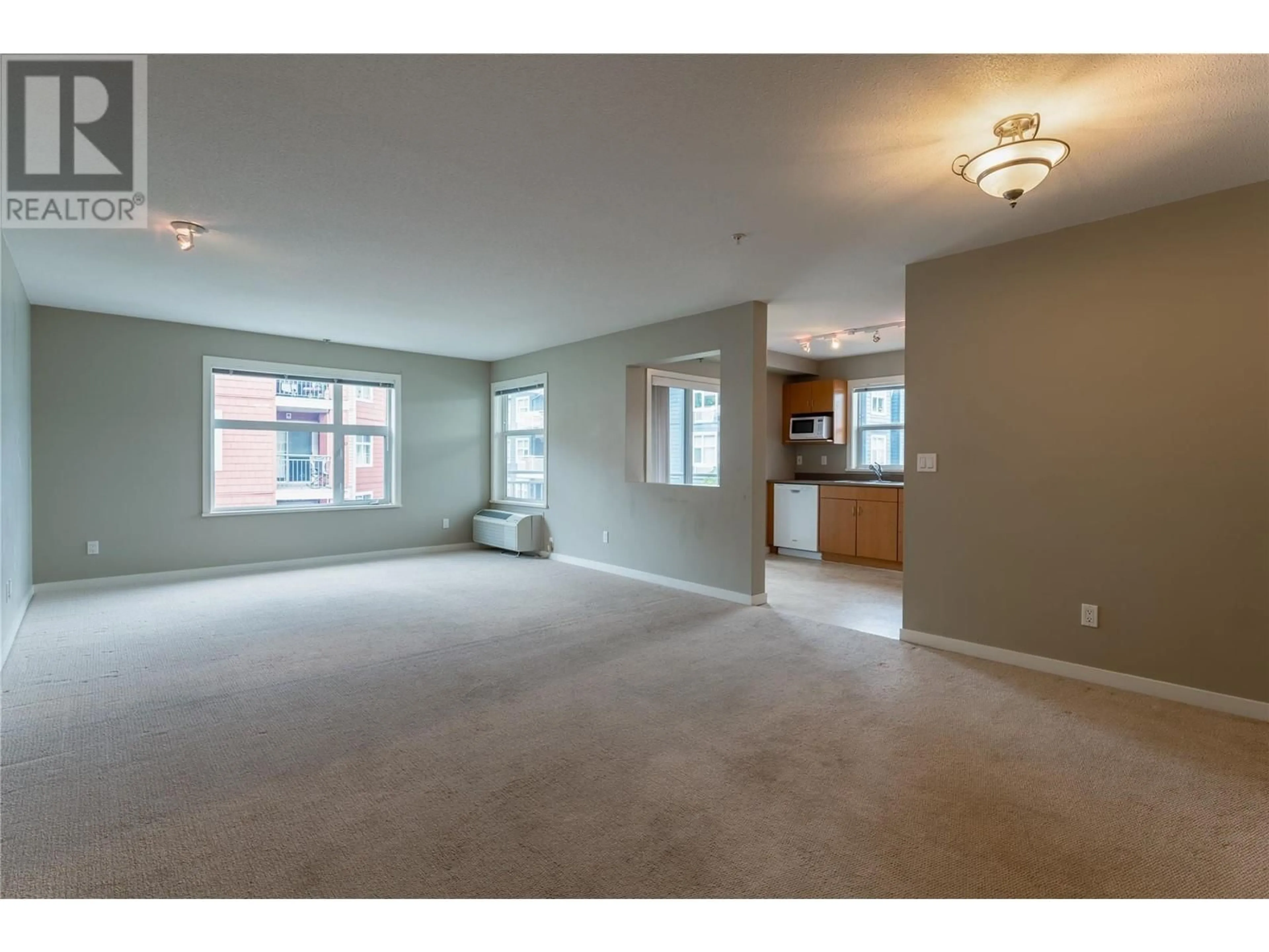 Living room with furniture, carpet floor for 563 Yates Road Unit# 302, Kelowna British Columbia V1V2V3