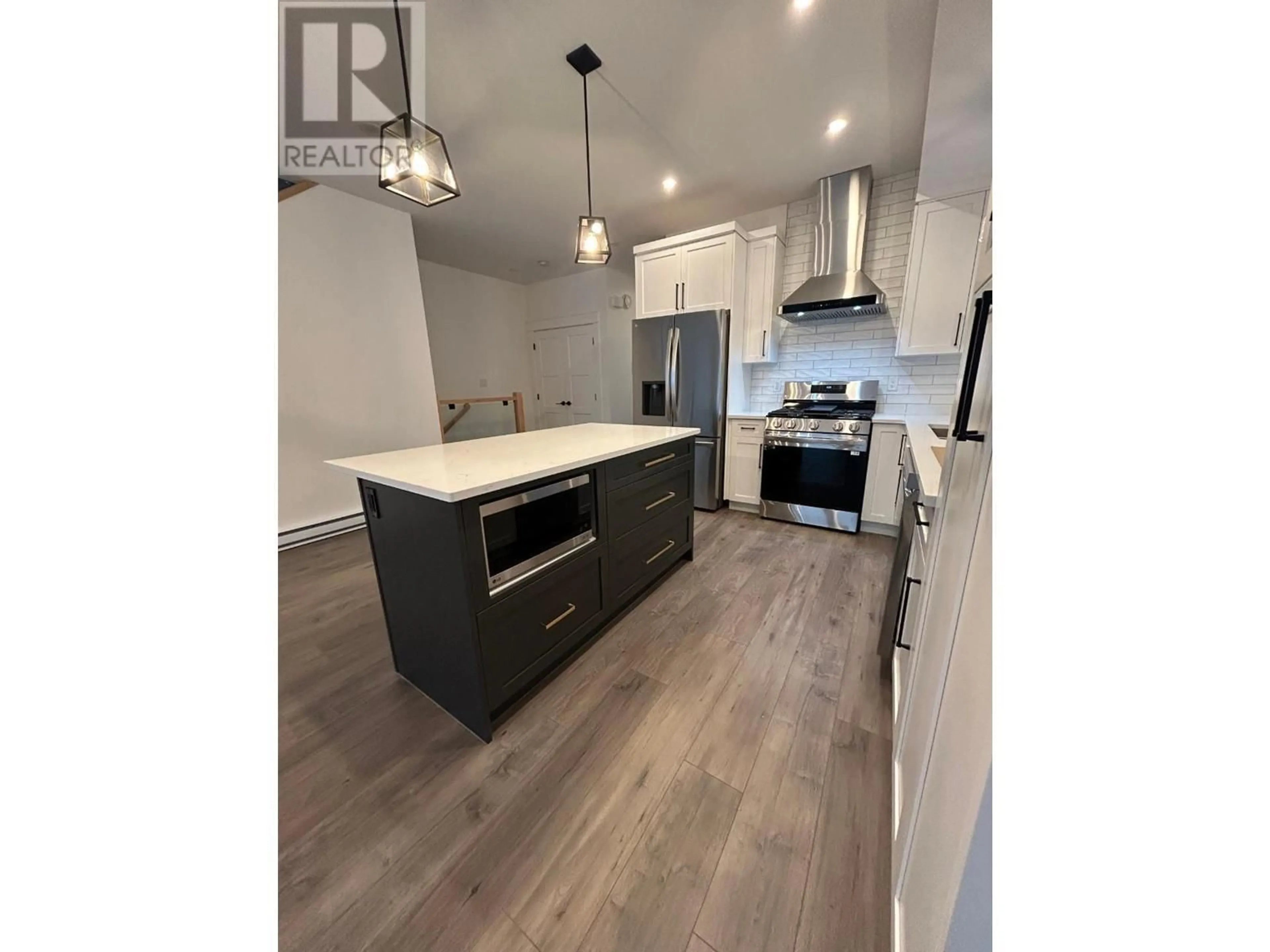 Open concept kitchen, wood/laminate floor for 1367 BURFIELD DRIVE, Sun Peaks British Columbia V0E5N0