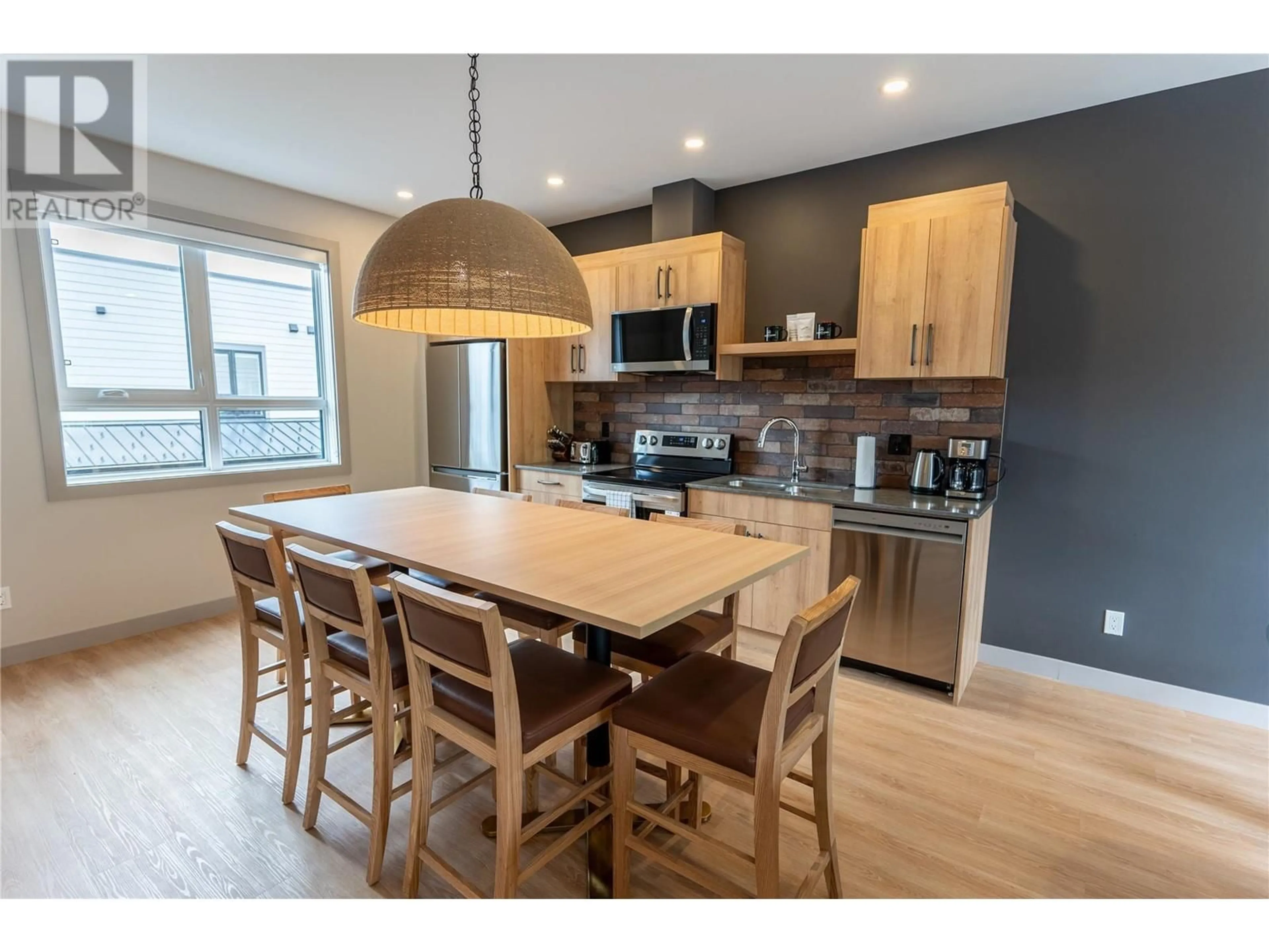 Open concept kitchen, wood/laminate floor for 112 Second Street E Unit# 218, Revelstoke British Columbia V0E2S0