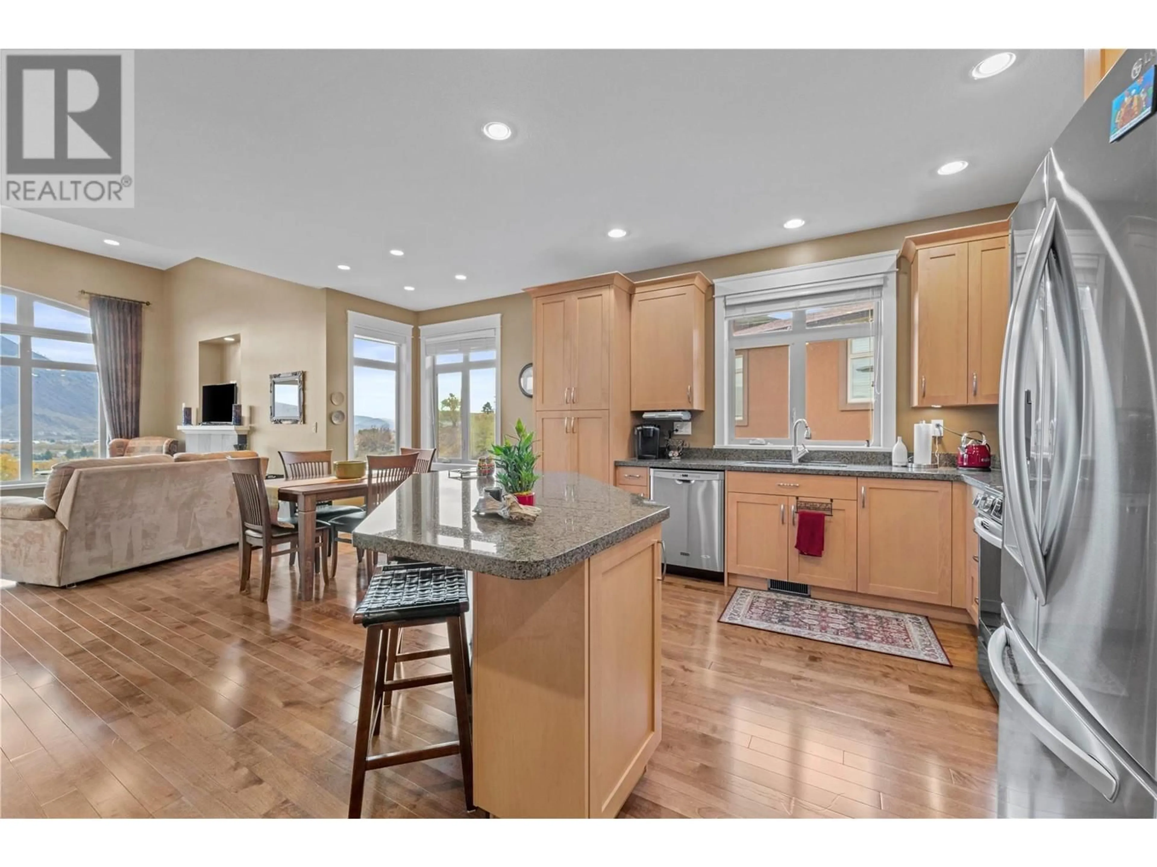 Open concept kitchen, wood/laminate floor for 15 Hudson's Bay Trail Unit# 828, Kamloops British Columbia V2C6S6