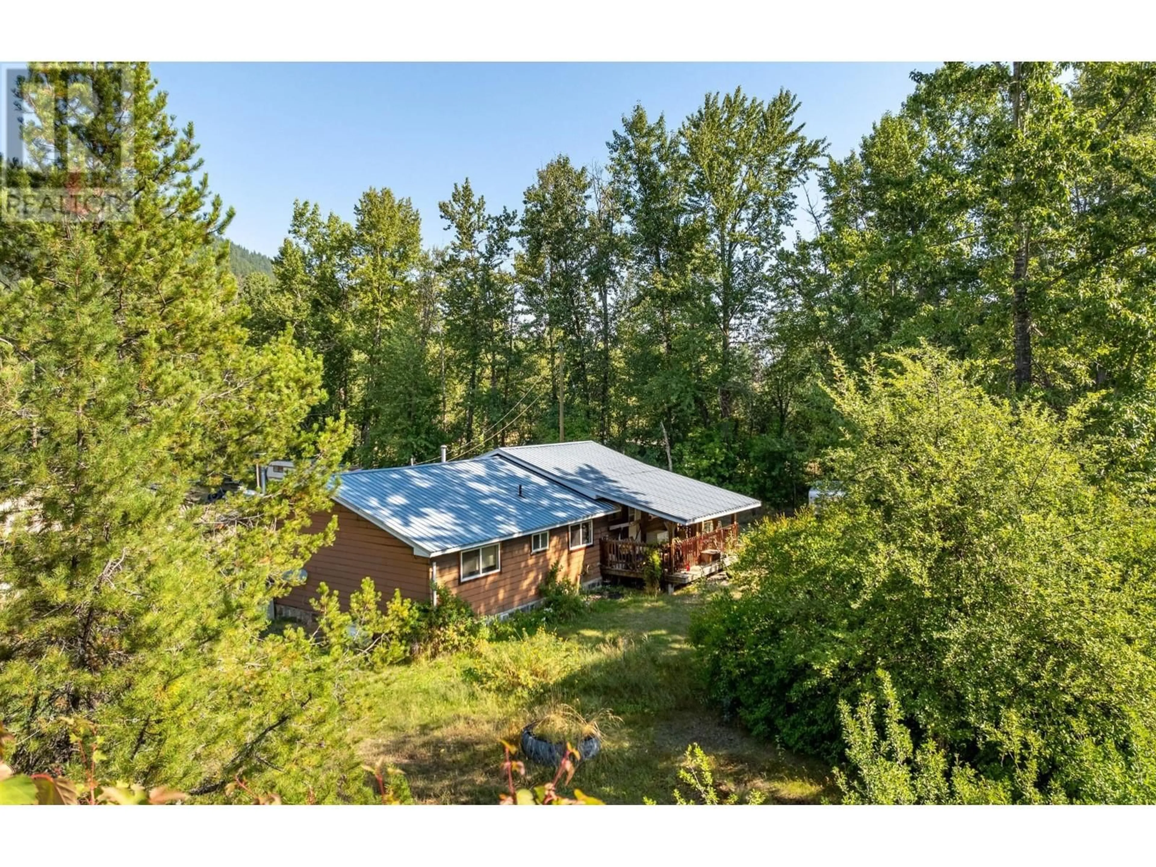 A pic from outside/outdoor area/front of a property/back of a property/a pic from drone, forest/trees view for 8927 RIVER Avenue, Yahk British Columbia V0B2P0