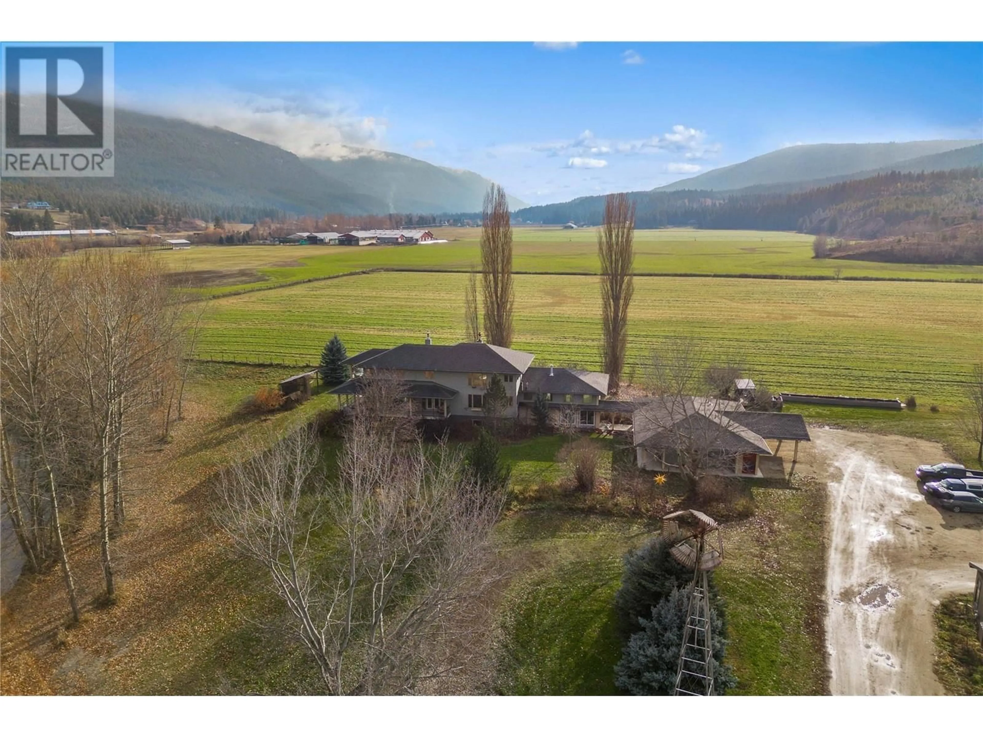 A pic from outside/outdoor area/front of a property/back of a property/a pic from drone, mountain view for 3169 Johnson Road, Salmon Arm British Columbia V1E3E6