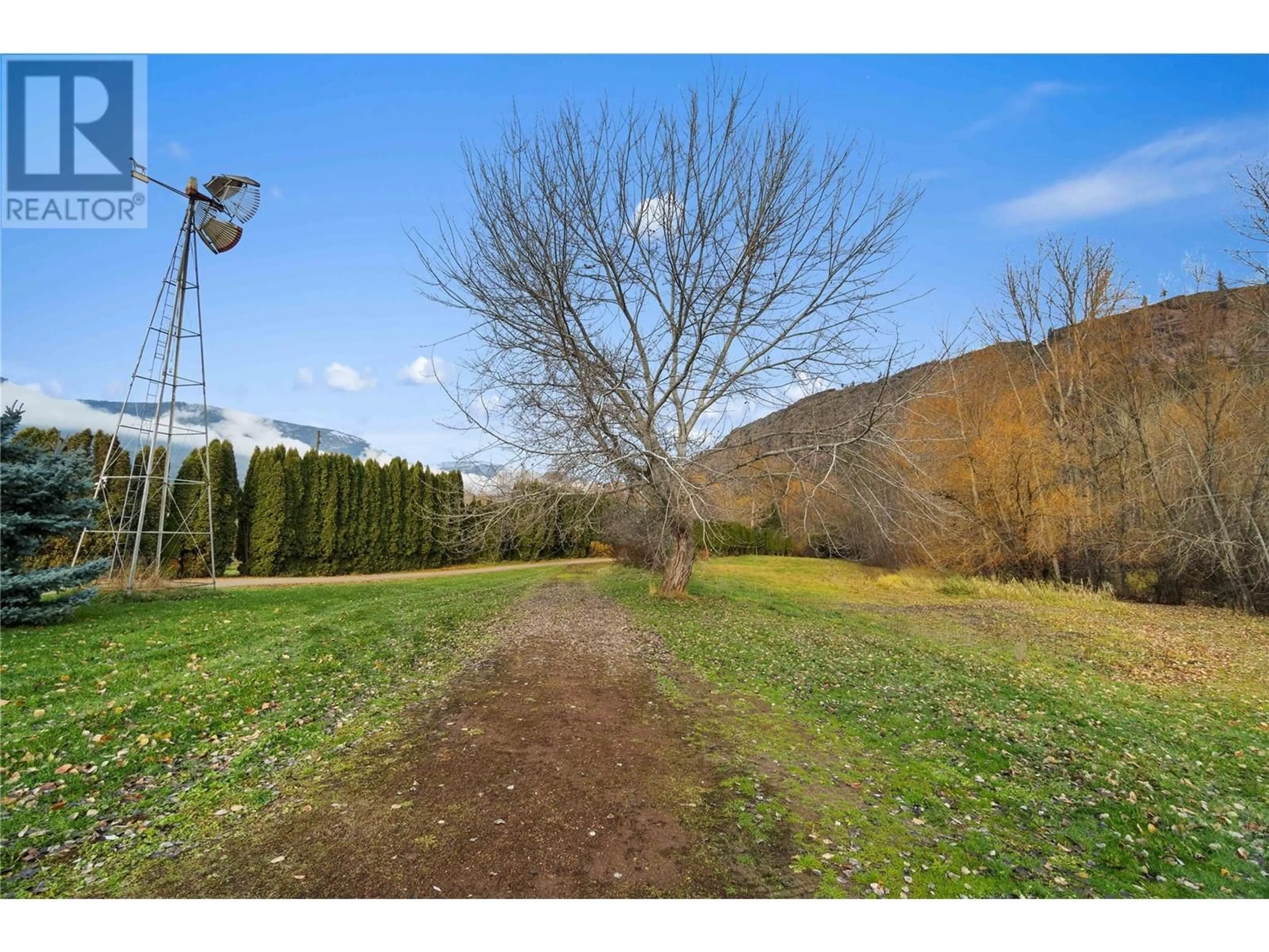 A pic from outside/outdoor area/front of a property/back of a property/a pic from drone, forest/trees view for 3169 Johnson Road, Salmon Arm British Columbia V1E3E6