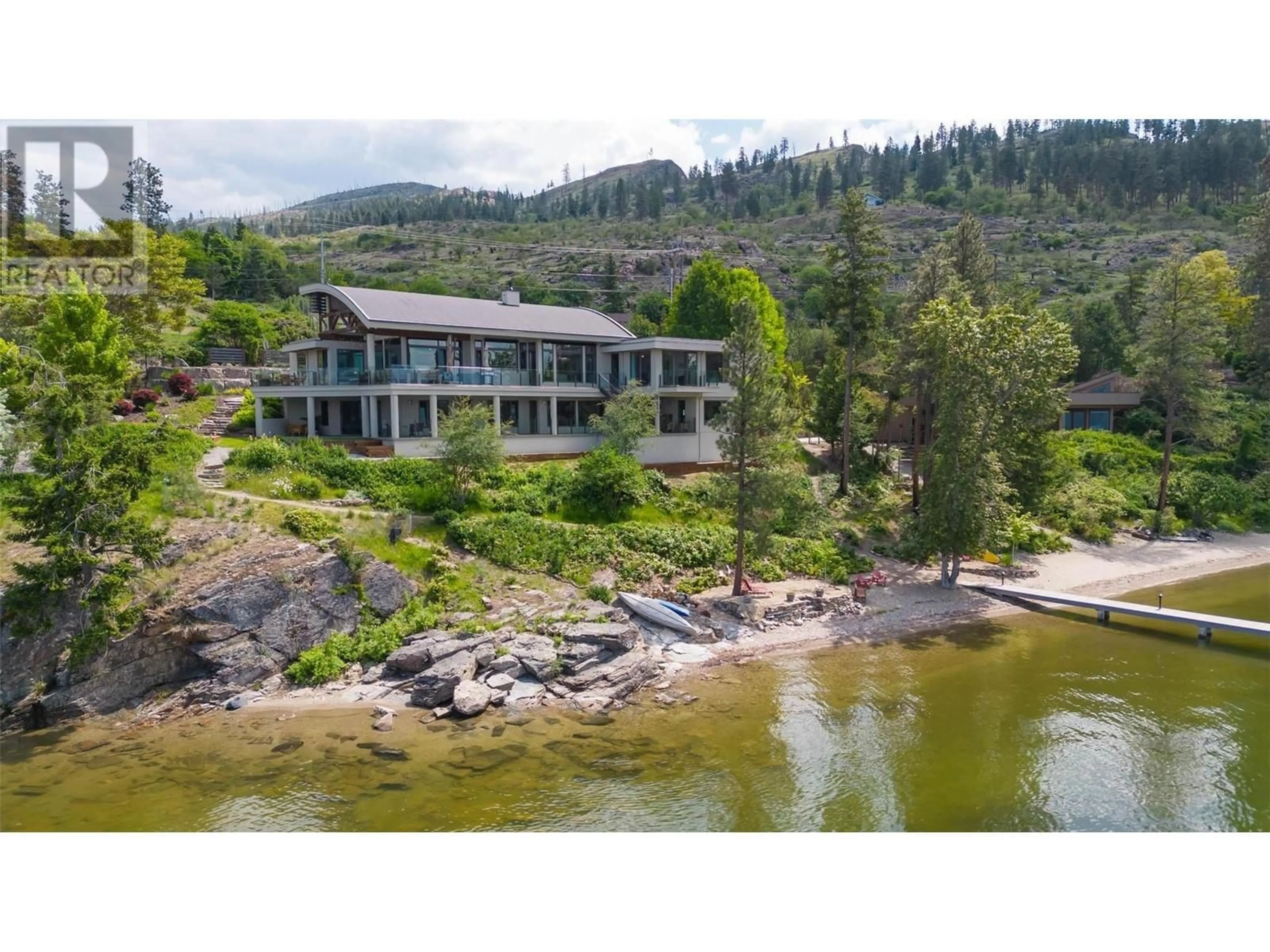 A pic from outside/outdoor area/front of a property/back of a property/a pic from drone, water/lake/river/ocean view for 5560 Lakeshore Road, Kelowna British Columbia V1W4J4