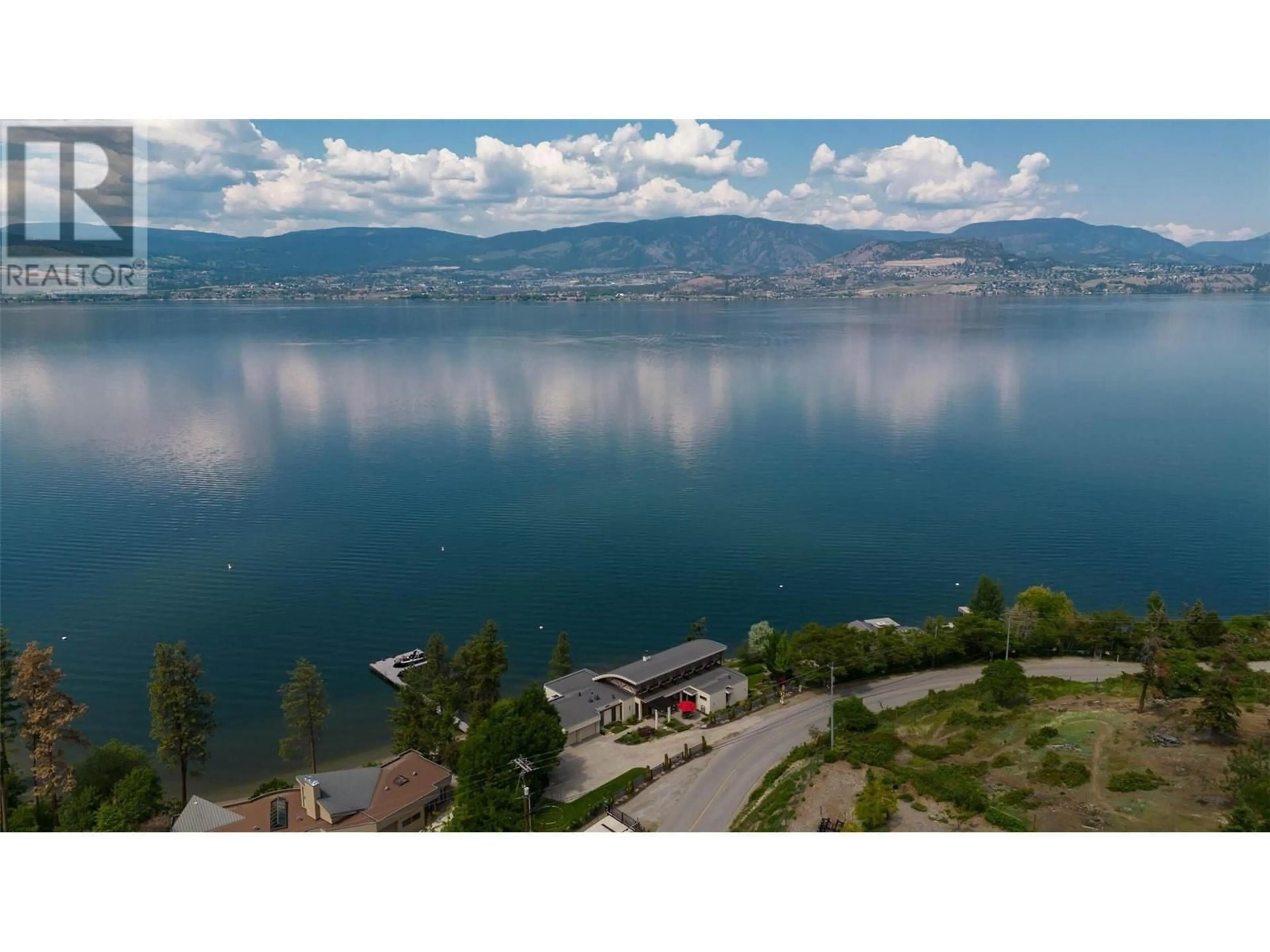 A pic from outside/outdoor area/front of a property/back of a property/a pic from drone, water/lake/river/ocean view for 5560 Lakeshore Road, Kelowna British Columbia V1W4J4