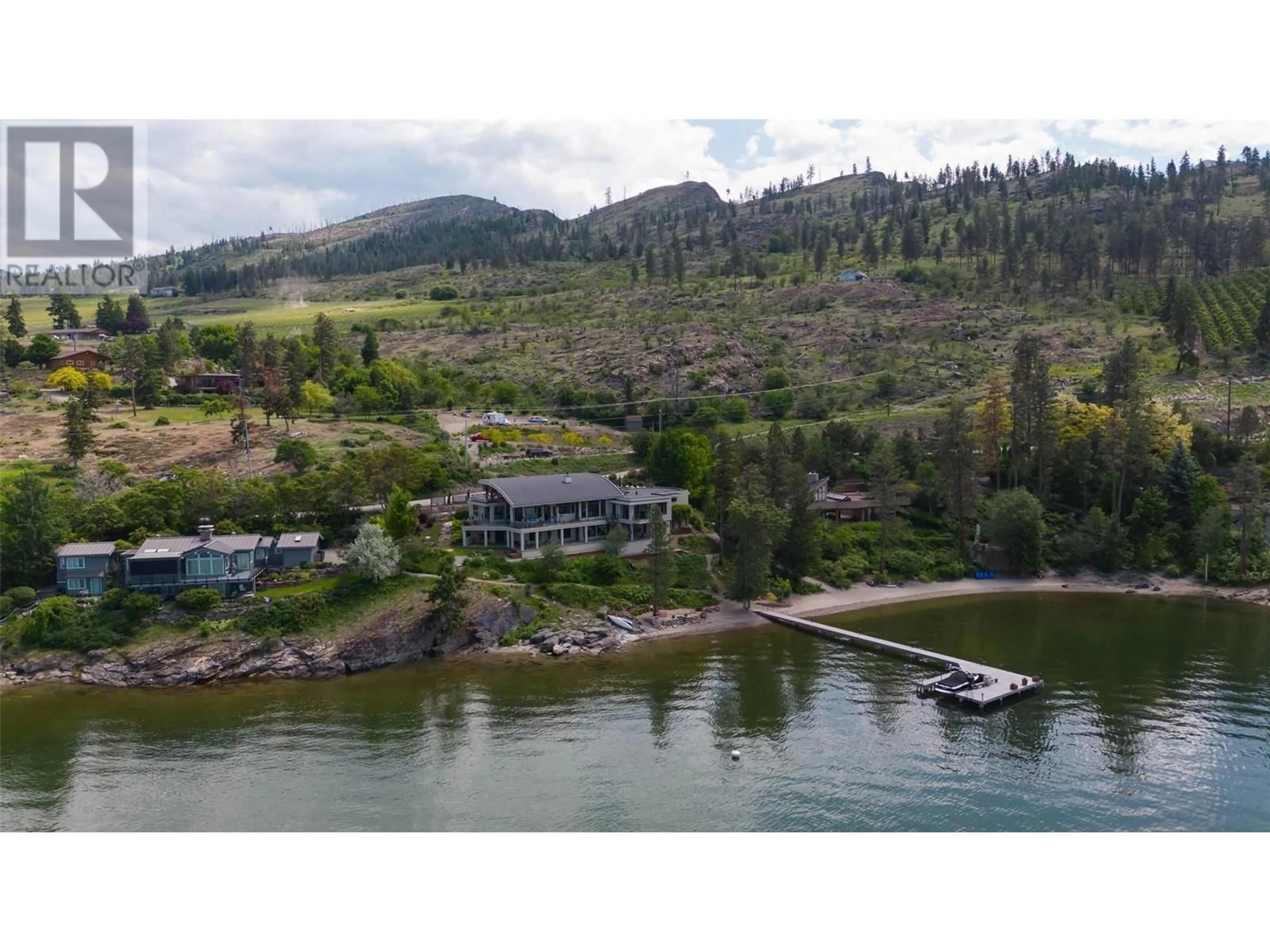 A pic from outside/outdoor area/front of a property/back of a property/a pic from drone, water/lake/river/ocean view for 5560 Lakeshore Road, Kelowna British Columbia V1W4J4