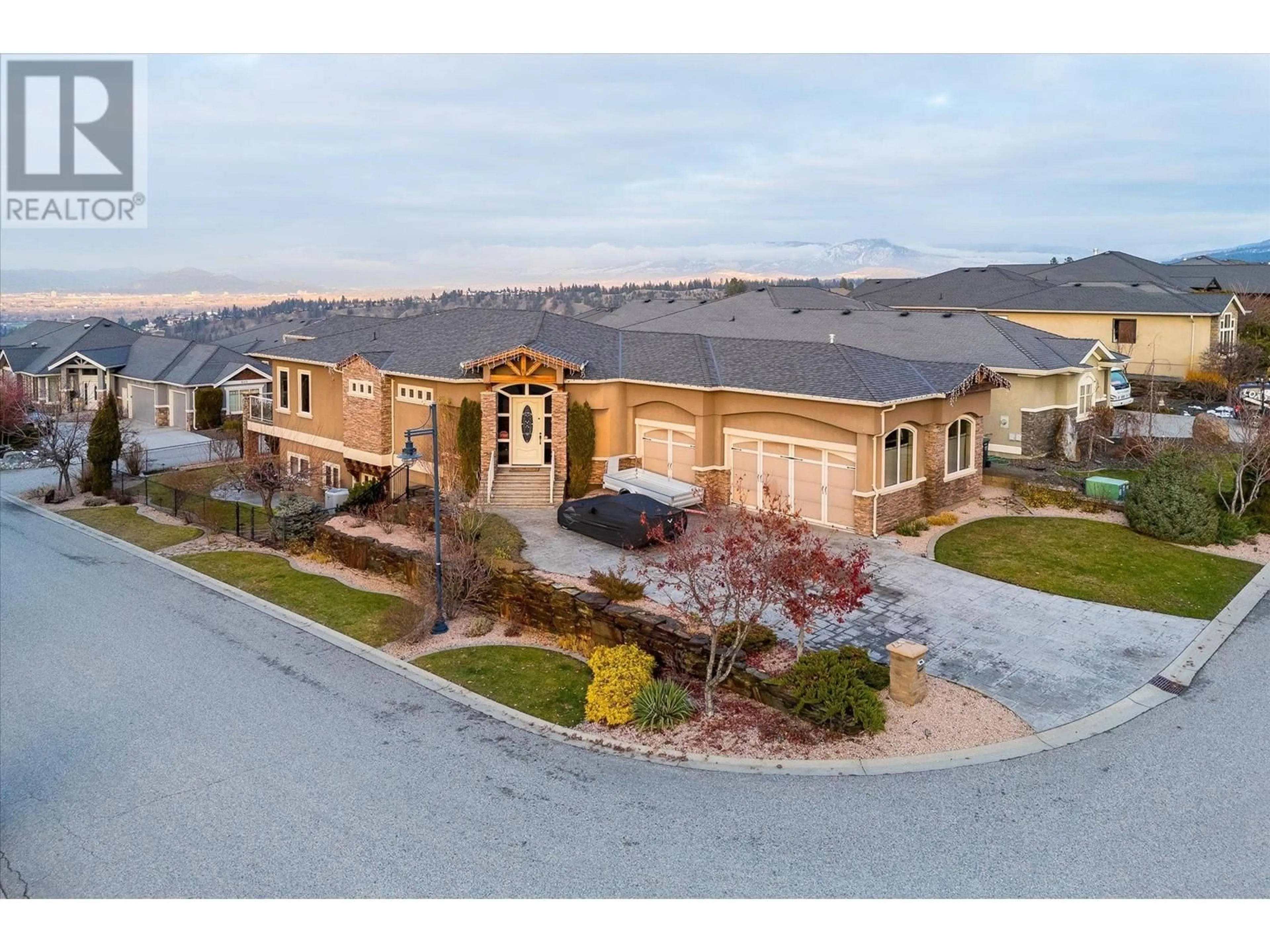 A pic from outside/outdoor area/front of a property/back of a property/a pic from drone, mountain view for 603 Arbor View Drive, Kelowna British Columbia V1W4Z7