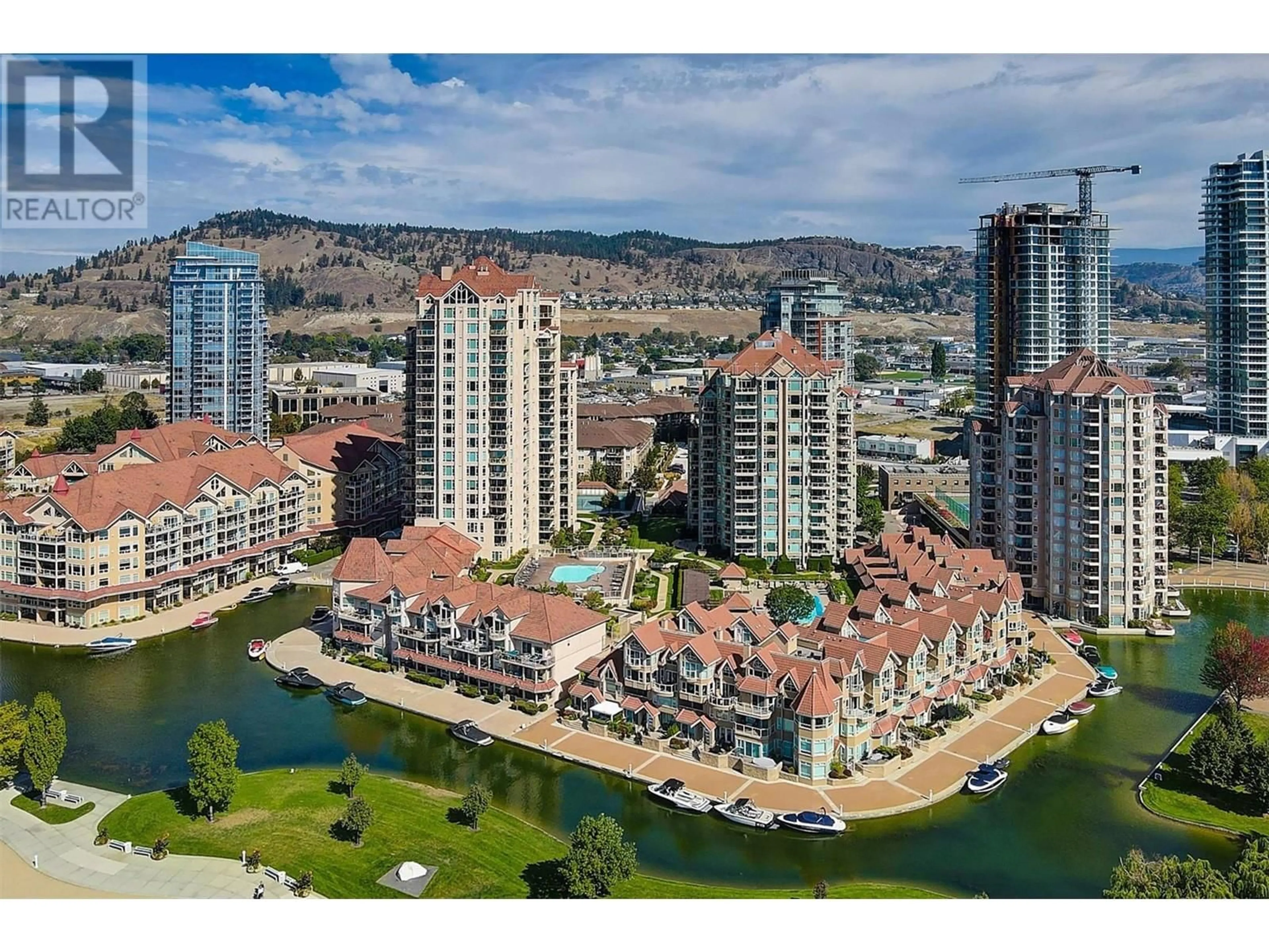 A pic from outside/outdoor area/front of a property/back of a property/a pic from drone, water/lake/river/ocean view for 1152 Sunset Drive Unit# 801, Kelowna British Columbia V1Y9R7