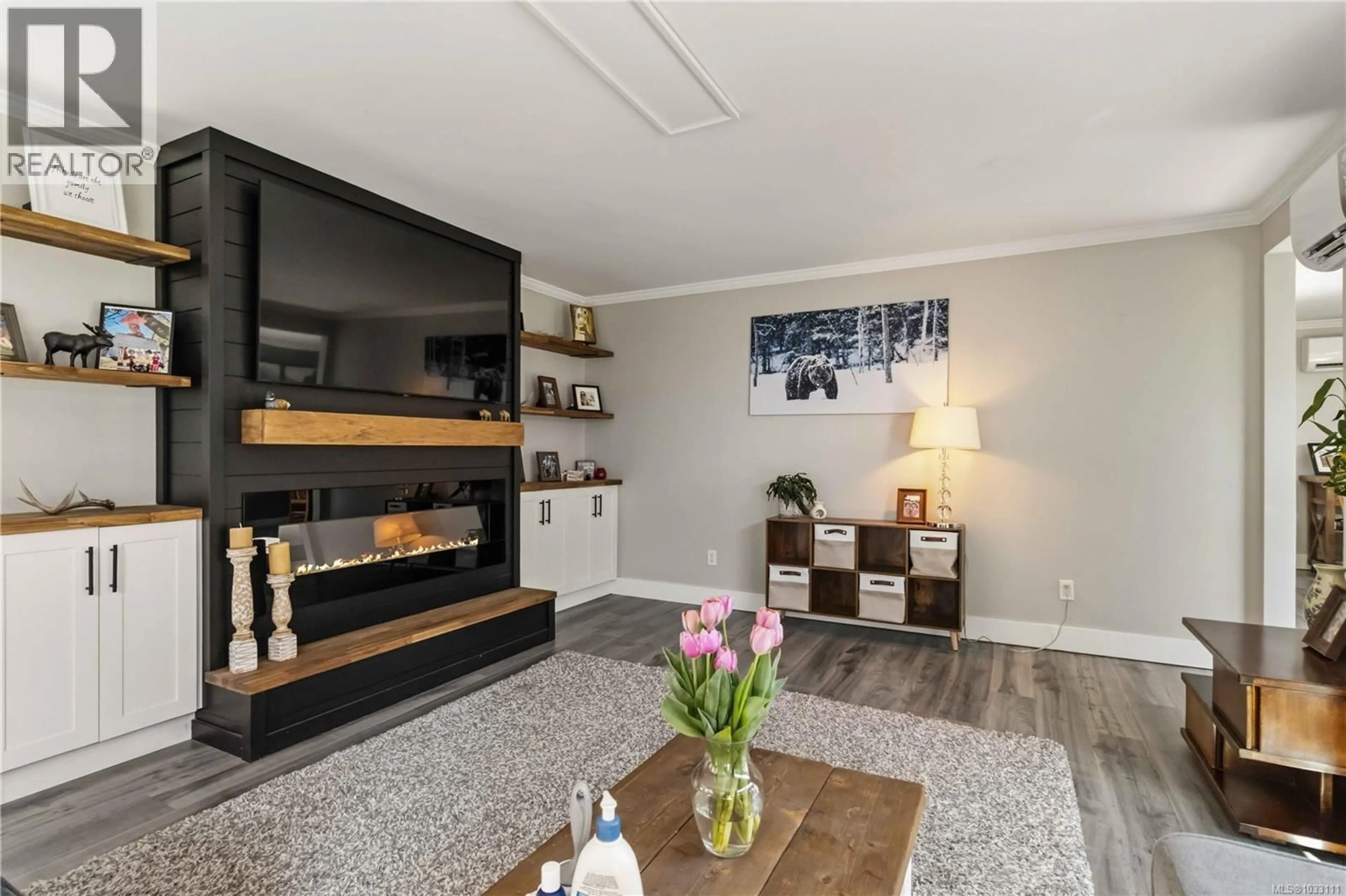 Living room with furniture, wood/laminate floor for 3395 ST. TROY PLACE, Colwood British Columbia V9C3J7
