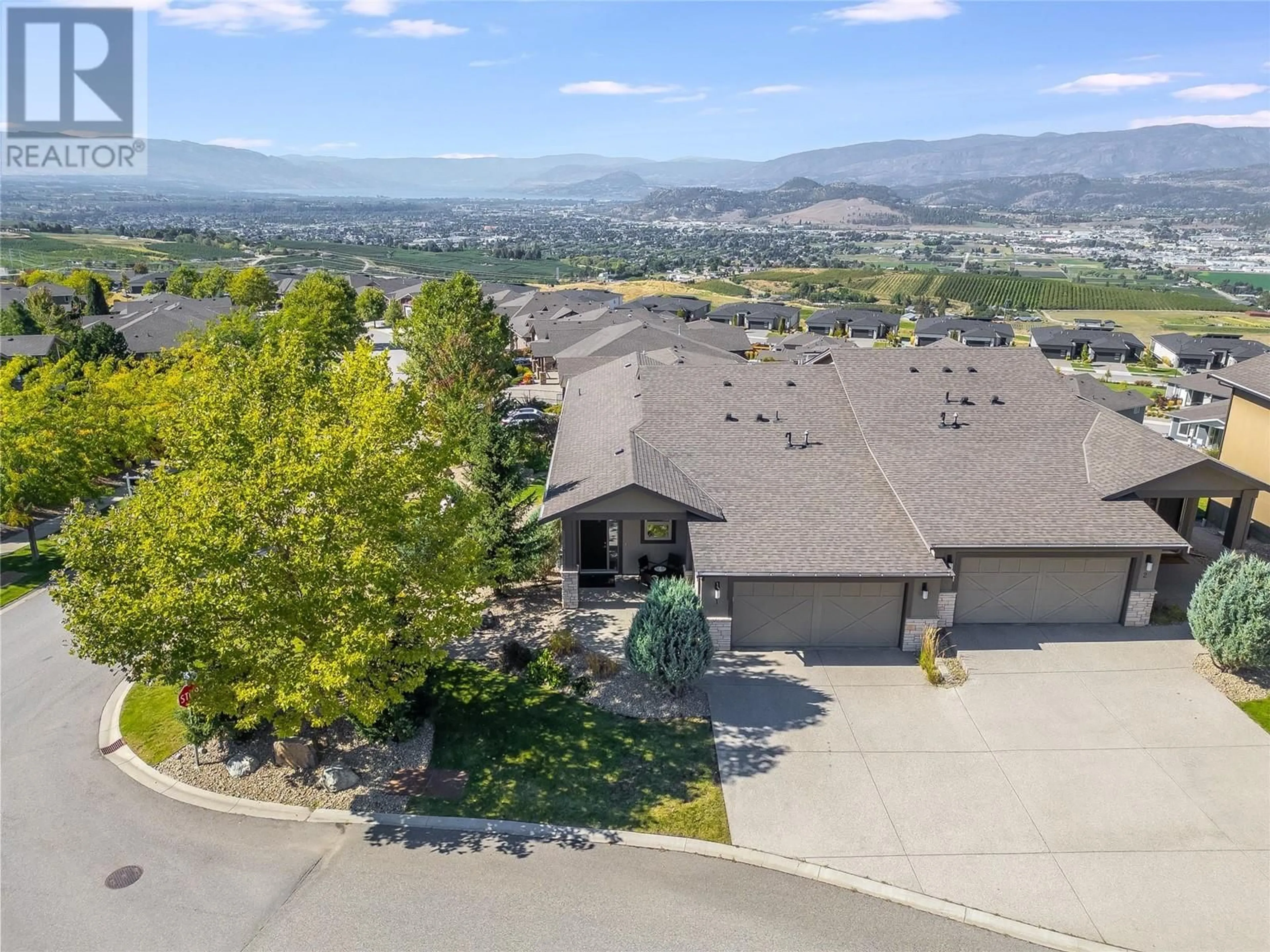 A pic from outside/outdoor area/front of a property/back of a property/a pic from drone, mountain view for 1836 Tower Ranch Boulevard Unit# 1, Kelowna British Columbia V1P1S8