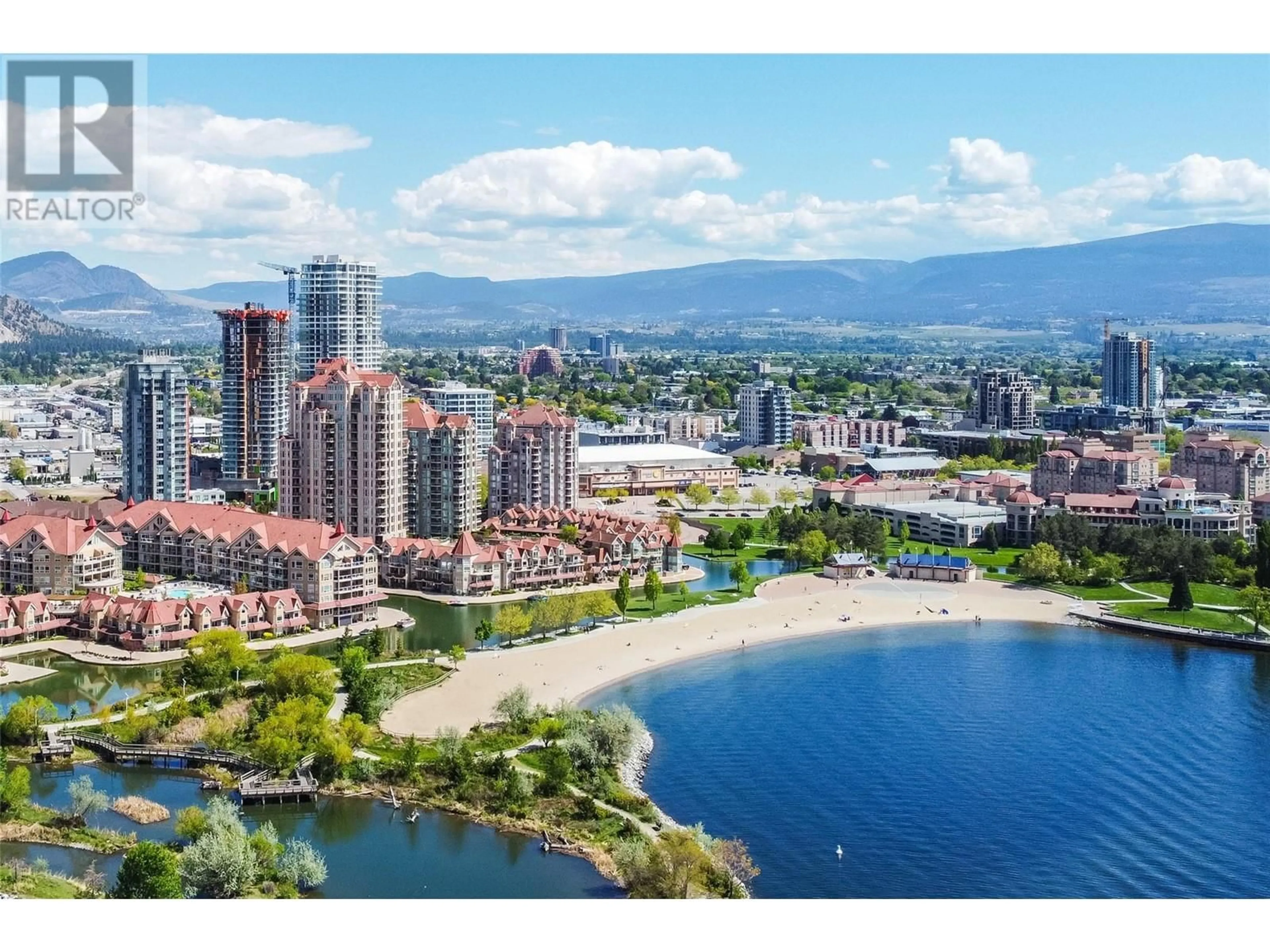 A pic from outside/outdoor area/front of a property/back of a property/a pic from drone, water/lake/river/ocean view for 1128 Sunset Drive Unit# 407, Kelowna British Columbia V1Y9W7