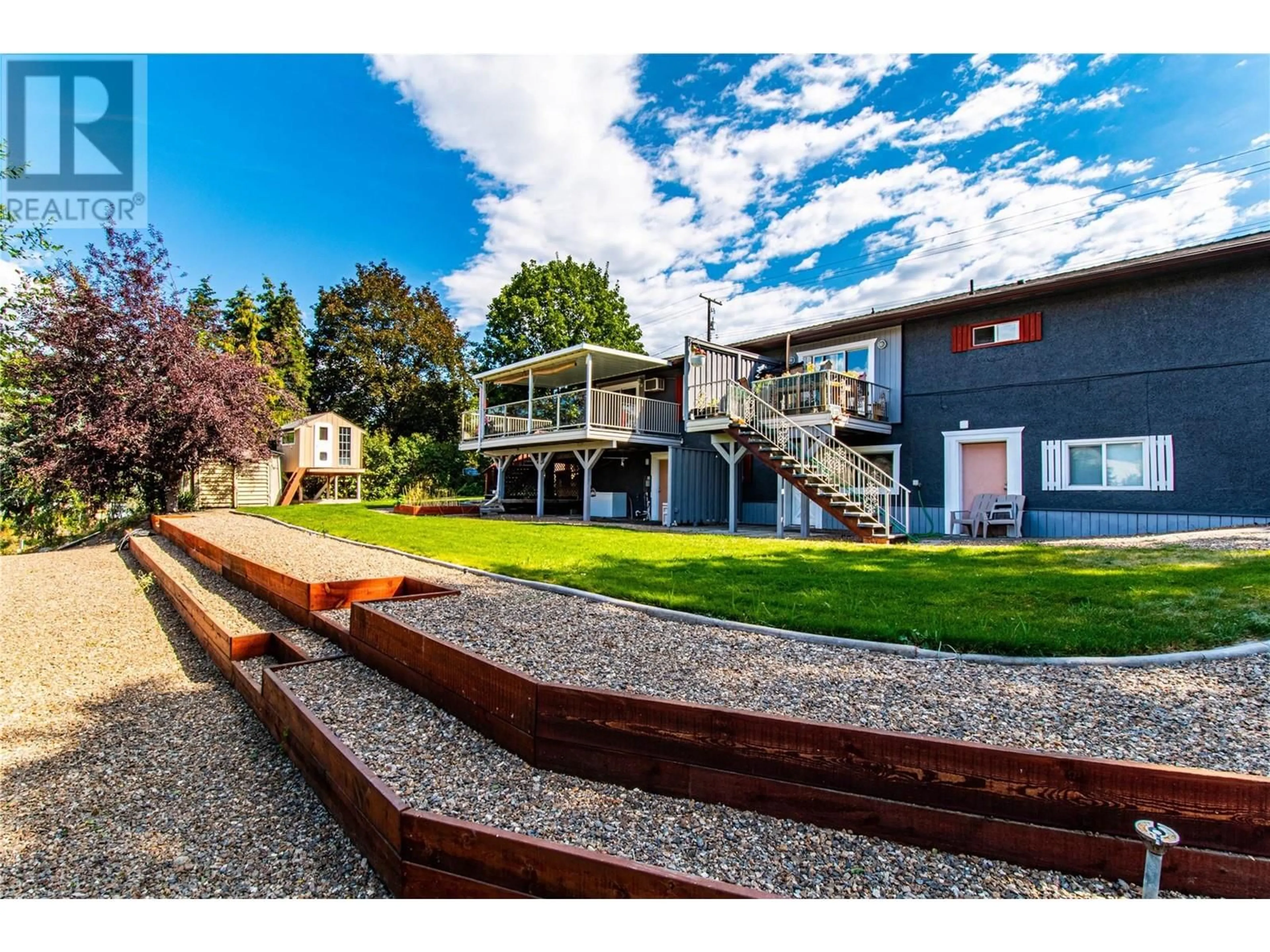 A pic from outside/outdoor area/front of a property/back of a property/a pic from drone, mountain view for 4904 PLEASANT VALLEY ROAD, Vernon British Columbia V1B3L7