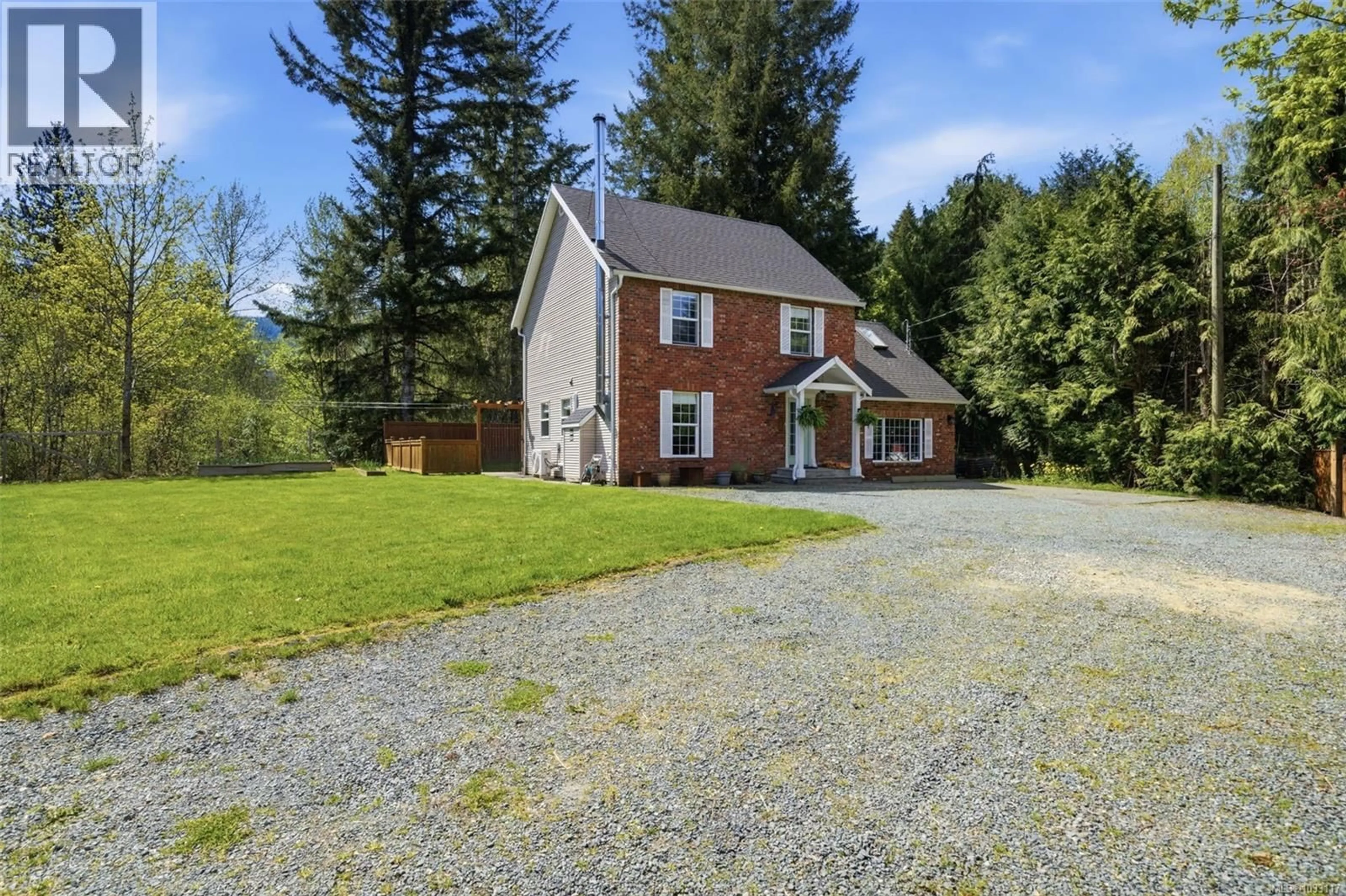 A pic from outside/outdoor area/front of a property/back of a property/a pic from drone, street for 100 COMIAKEN AVENUE, Lake Cowichan British Columbia V0R2G0