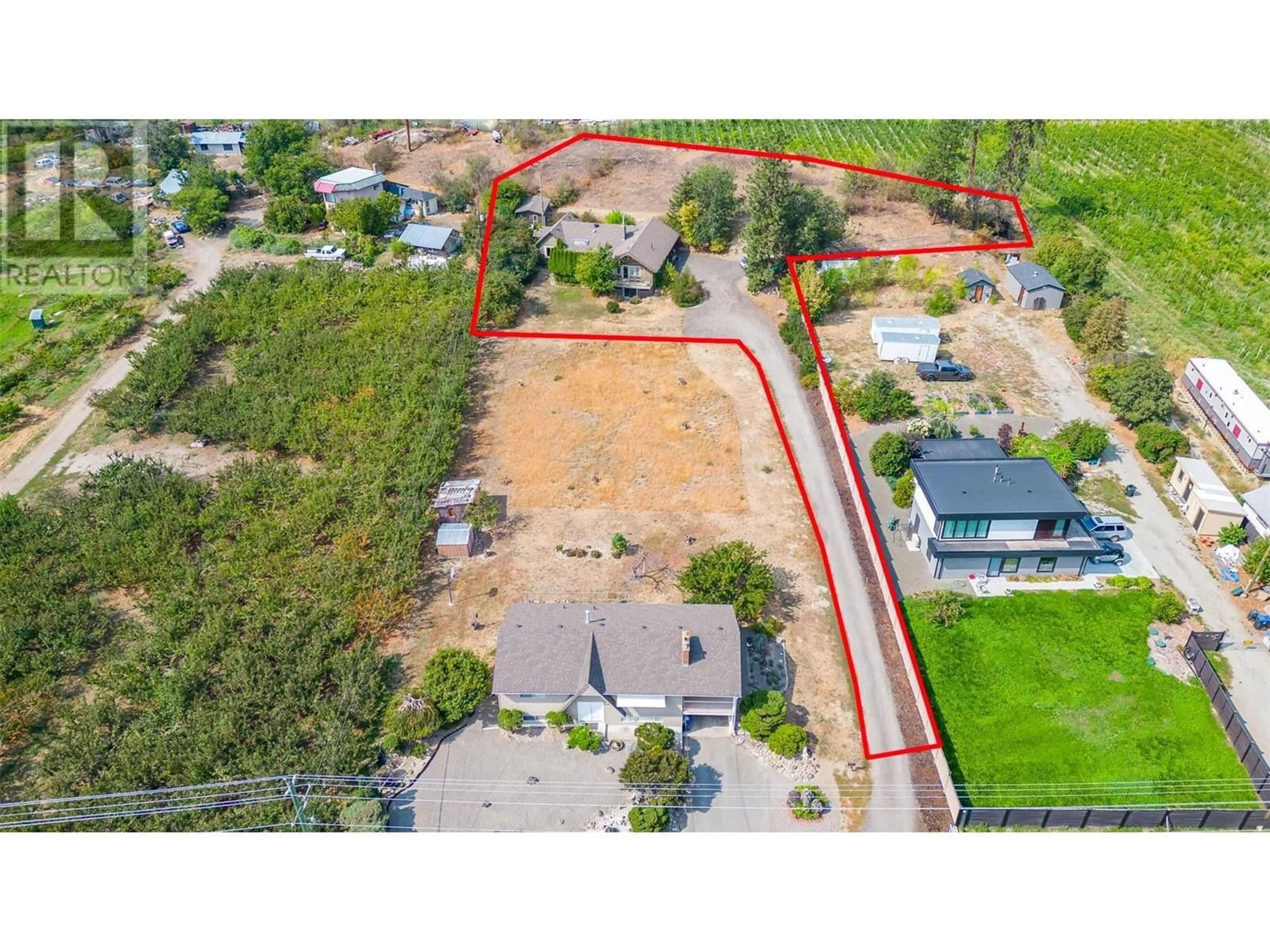 A pic from outside/outdoor area/front of a property/back of a property/a pic from drone, street for 3586 Elliott Road, West Kelowna British Columbia V4T1N9