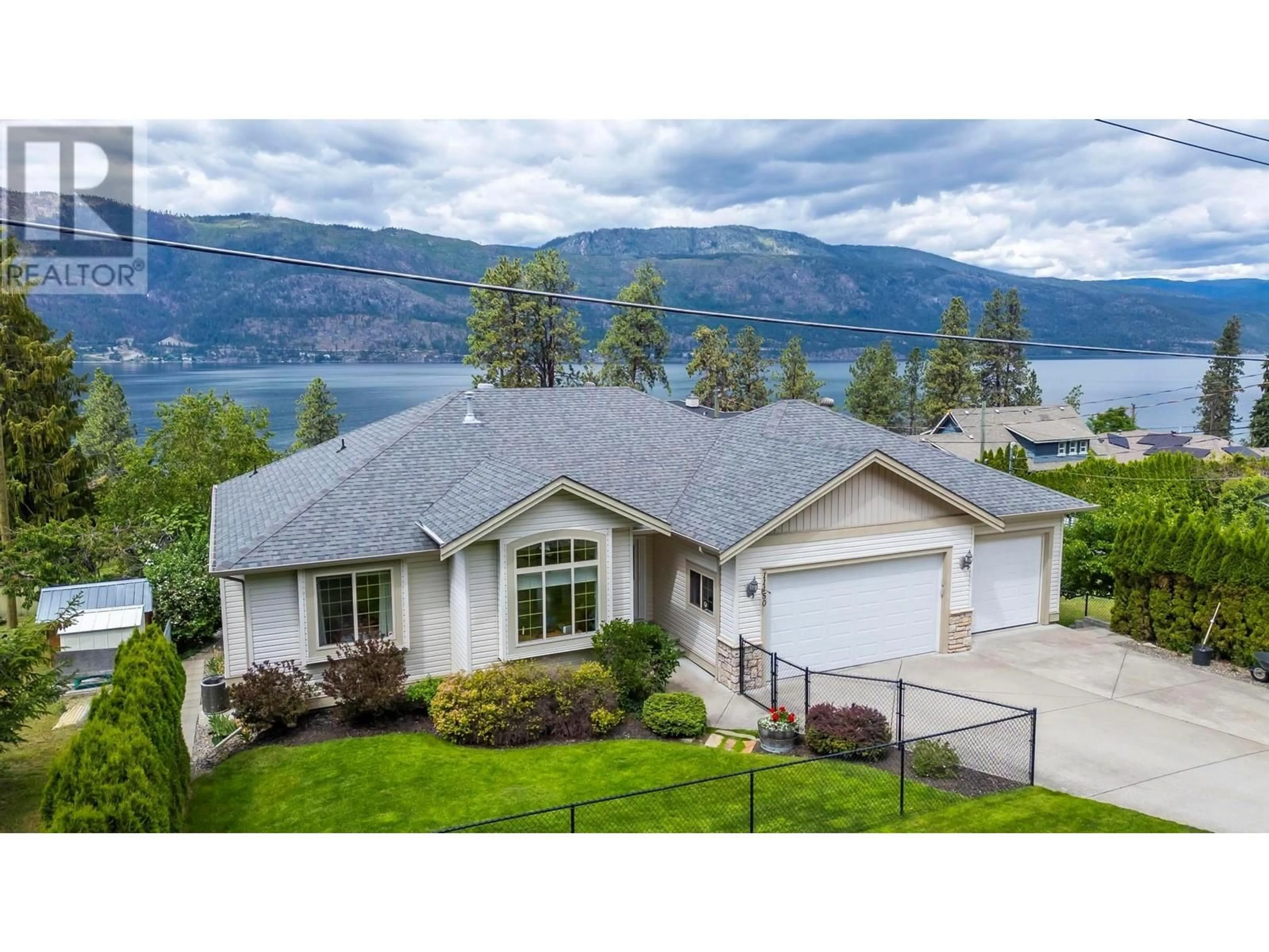 A pic from outside/outdoor area/front of a property/back of a property/a pic from drone, water/lake/river/ocean view for 11150 Maddock Avenue, Lake Country British Columbia V4V2J7