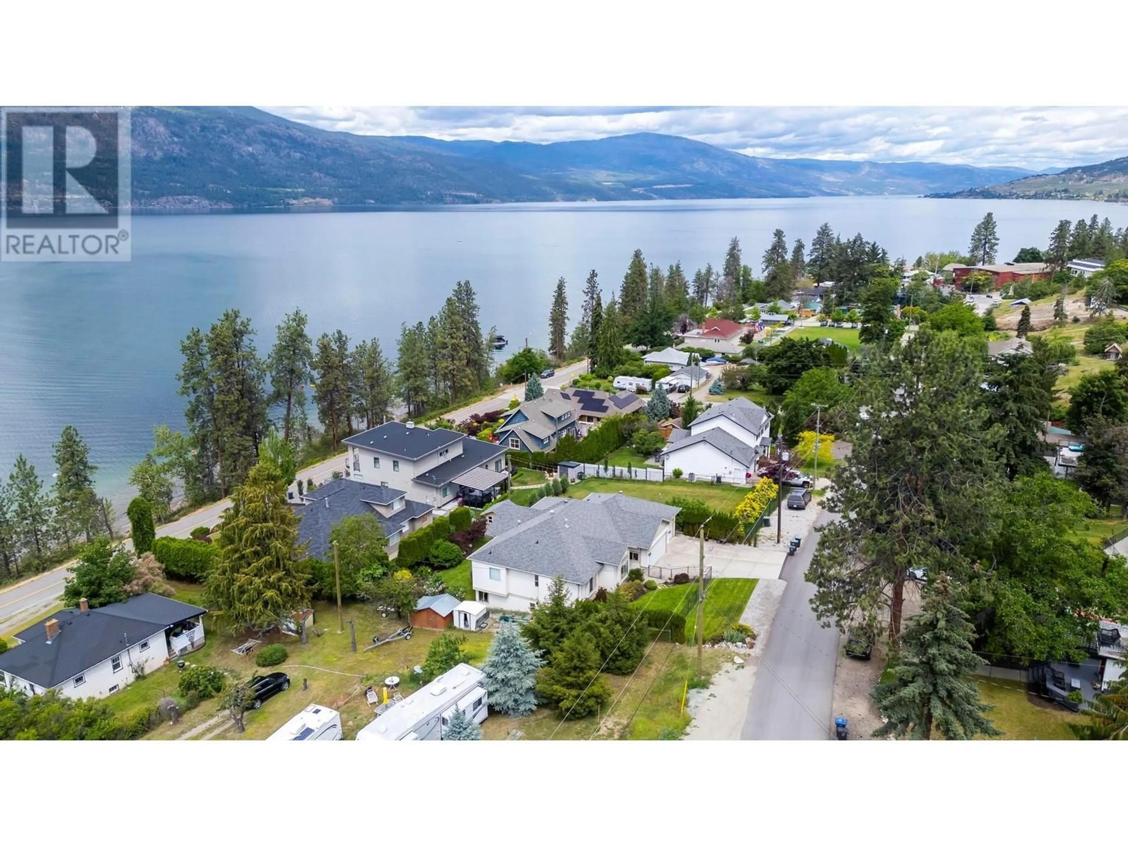 A pic from outside/outdoor area/front of a property/back of a property/a pic from drone, water/lake/river/ocean view for 11150 Maddock Avenue, Lake Country British Columbia V4V2J7