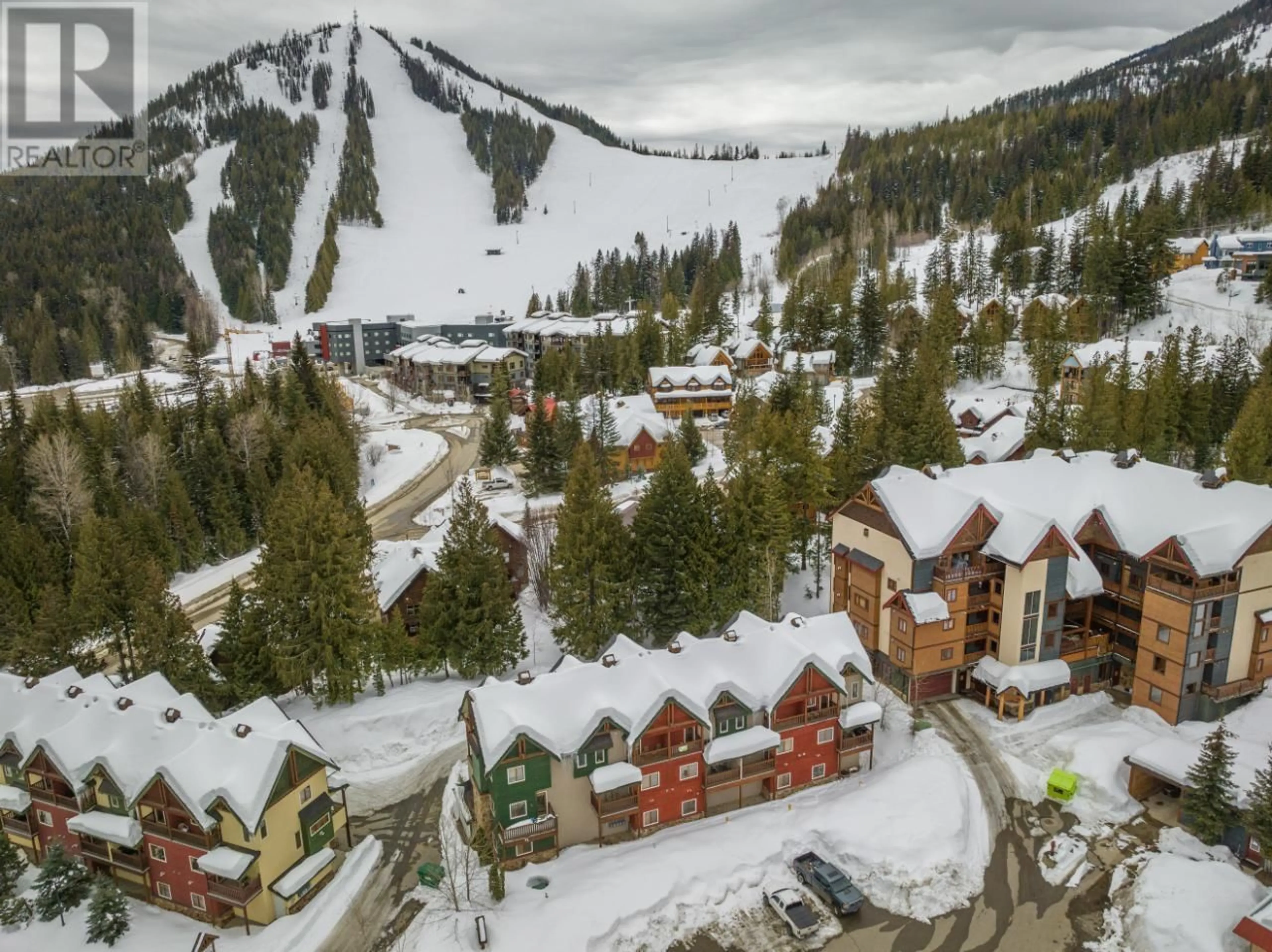 A pic from outside/outdoor area/front of a property/back of a property/a pic from drone, mountain view for 1003 MOUNTAIN VIEW Road Unit# B, Rossland British Columbia V0G1Y0