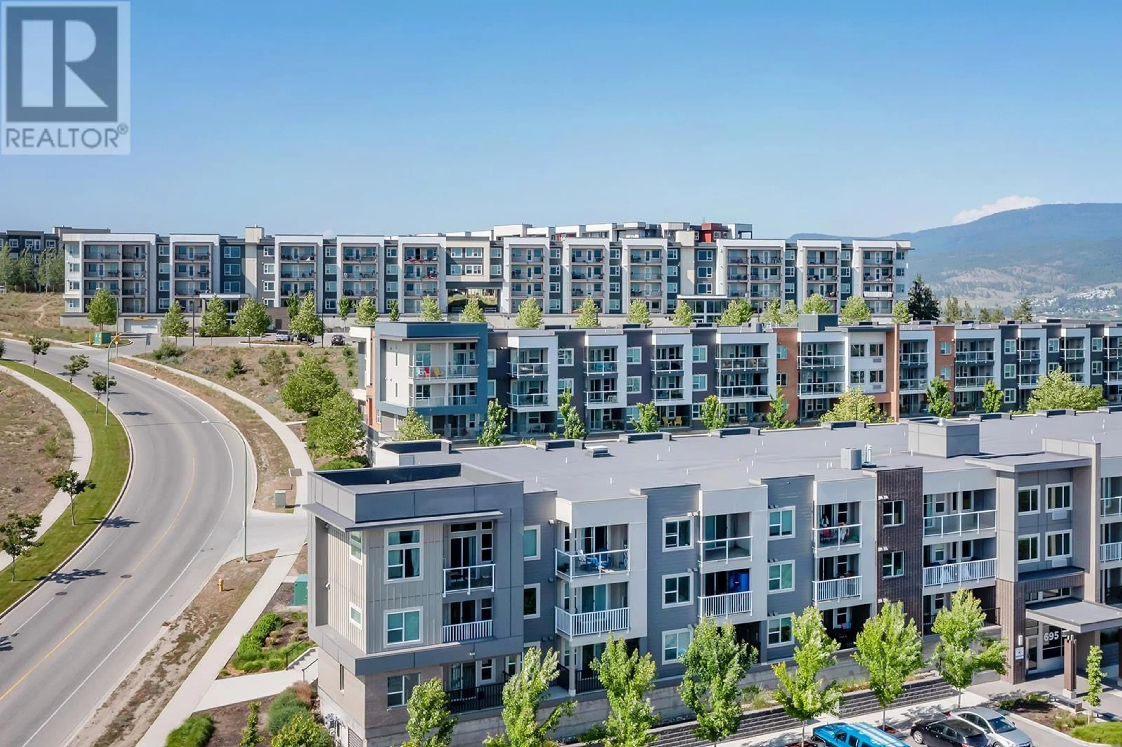 A pic from outside/outdoor area/front of a property/back of a property/a pic from drone, city buildings view from balcony for 775 Academy Way Unit# 208, Kelowna British Columbia V1V0A5