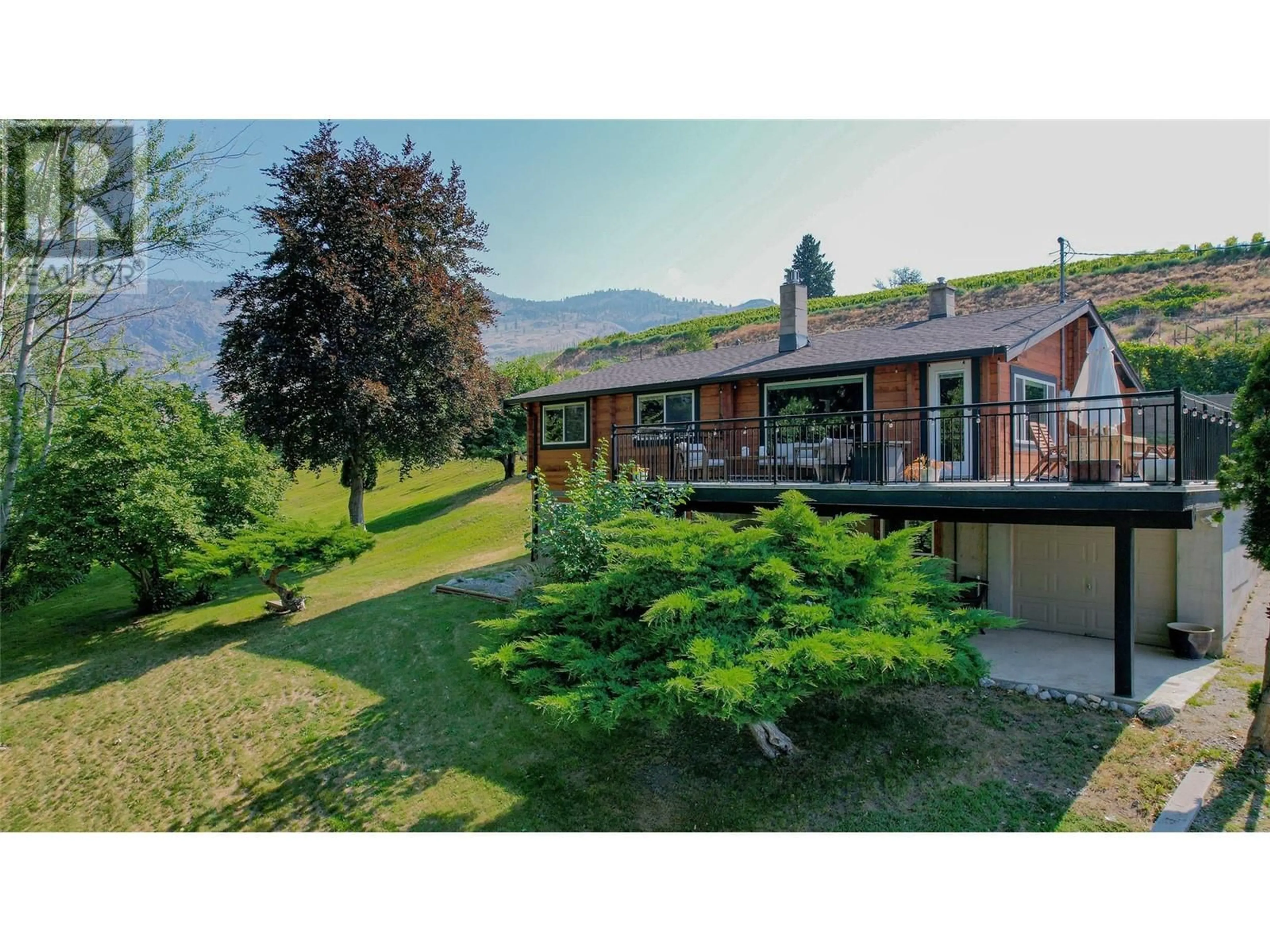 A pic from outside/outdoor area/front of a property/back of a property/a pic from drone, mountain view for 4613 41ST Street, Osoyoos British Columbia V0H1V6