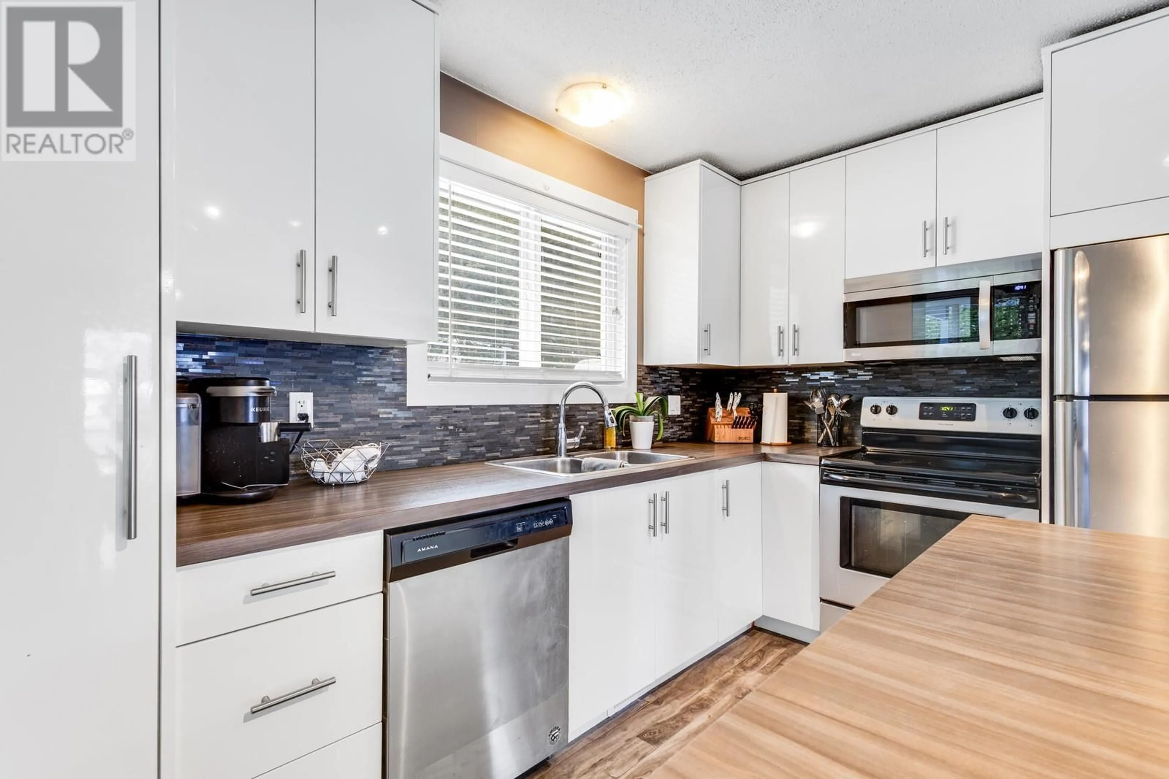 Contemporary kitchen, ceramic/tile floor for 1324 Ponderosa Road, West Kelowna British Columbia V1Z1M7