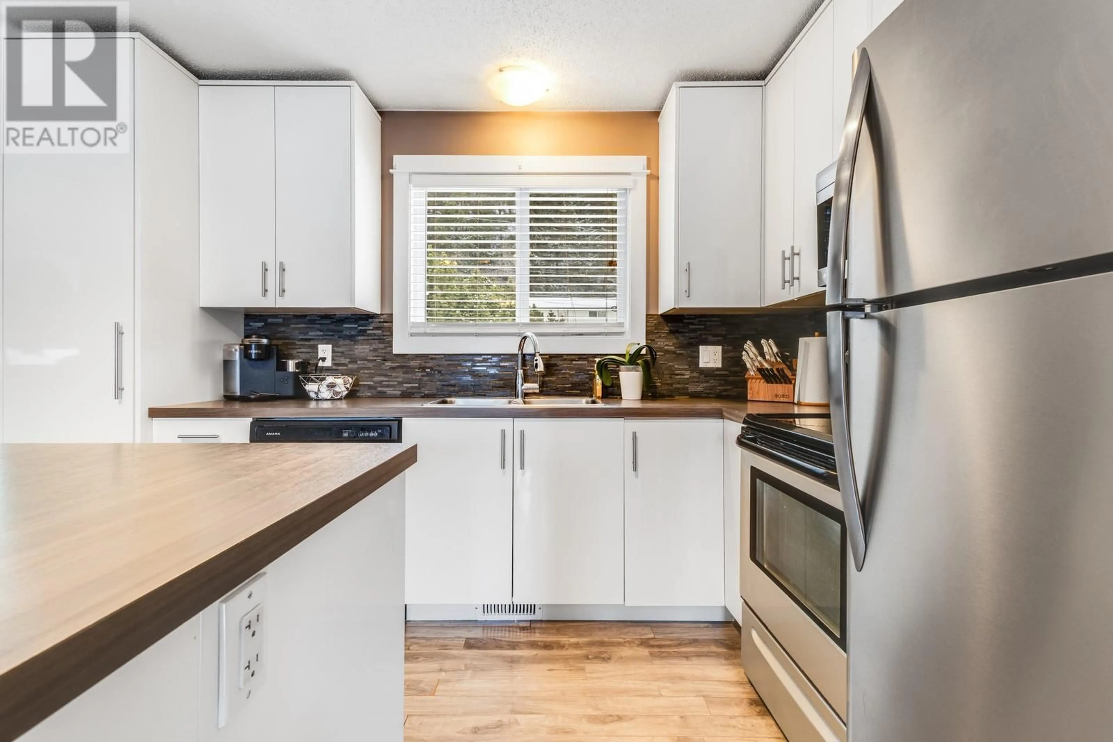 Standard kitchen, wood/laminate floor for 1324 Ponderosa Road, West Kelowna British Columbia V1Z1M7