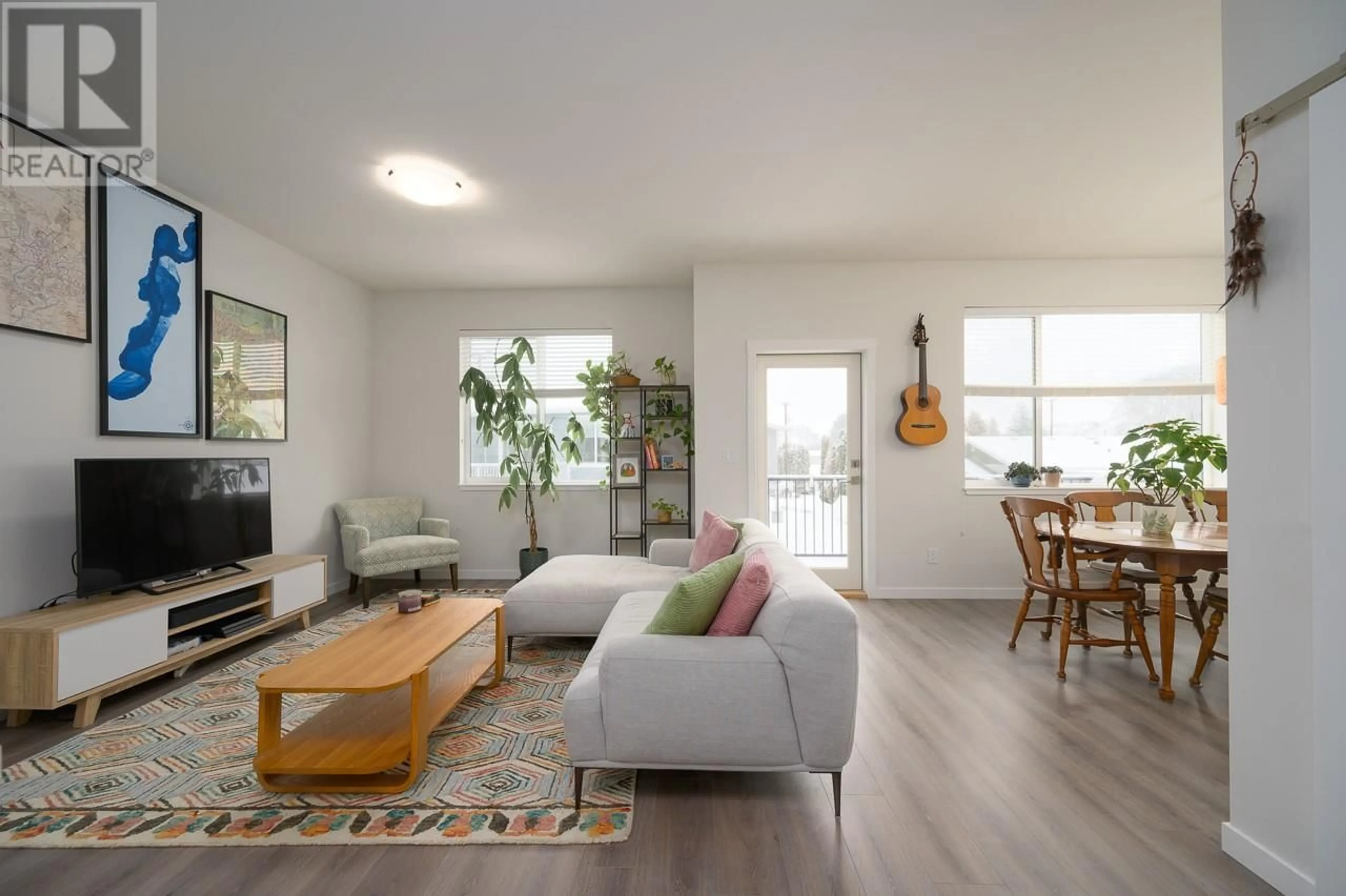 Living room with furniture, wood/laminate floor for 2925 WESTSYDE Road Unit# 114, Kamloops British Columbia V2B0J8