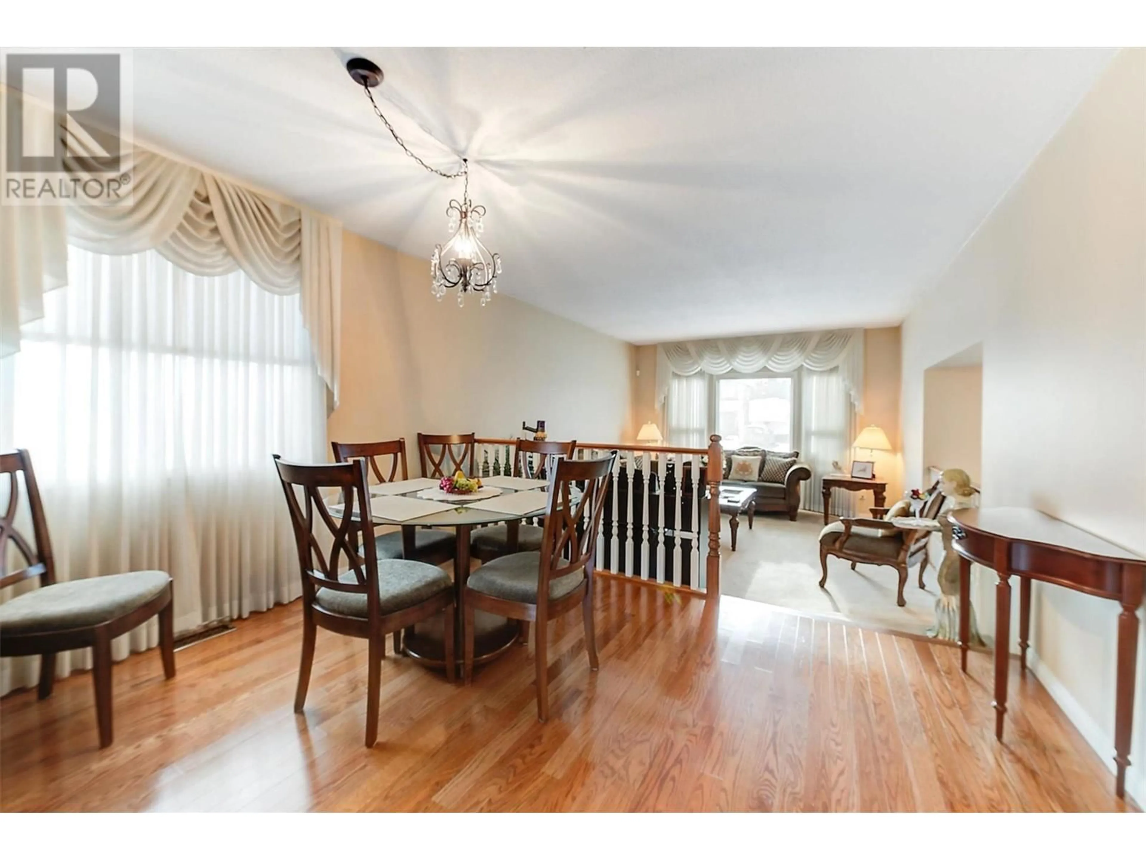 Dining room, wood/laminate floor for 1634 Carshyl Court, Kelowna British Columbia V1X6Y7