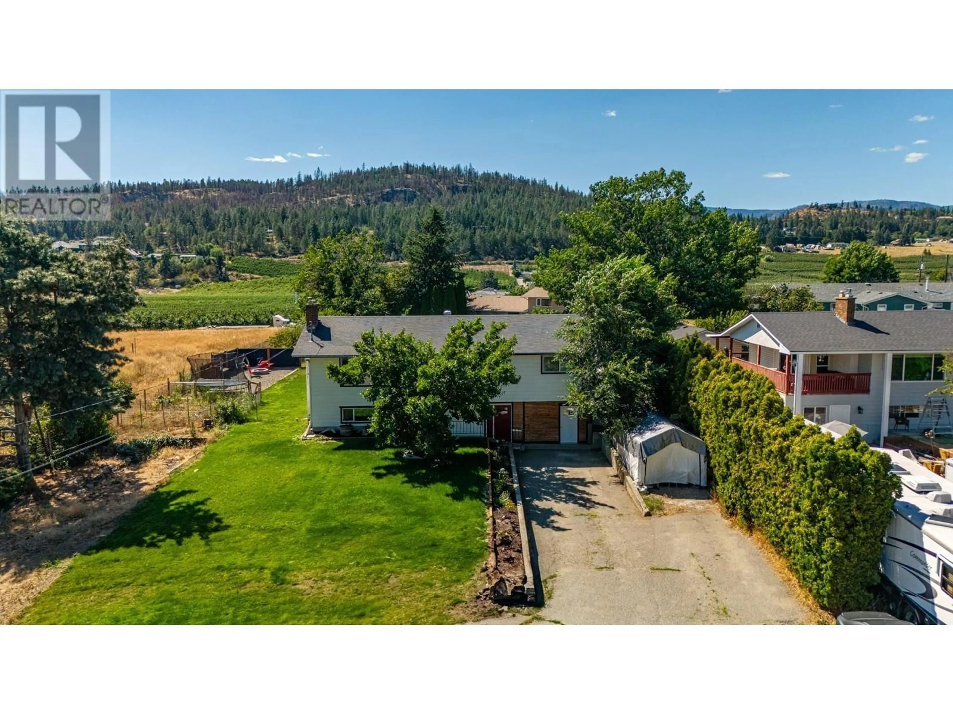 A pic from outside/outdoor area/front of a property/back of a property/a pic from drone, mountain view for 10010 Kel Win Road, Lake Country British Columbia V4V1L4