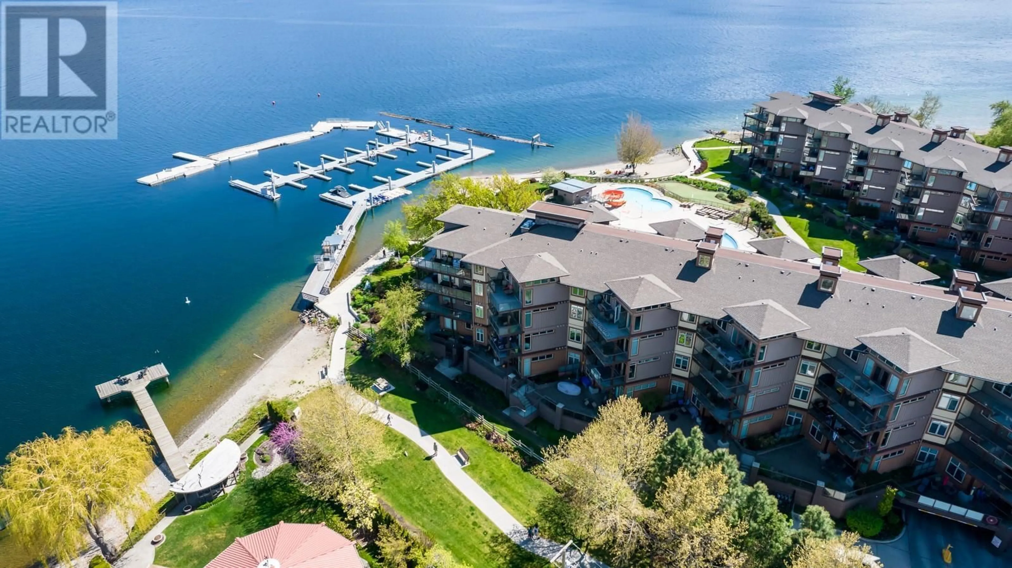 A pic from outside/outdoor area/front of a property/back of a property/a pic from drone, water/lake/river/ocean view for 304 - 4205 GELLATLY ROAD, West Kelowna British Columbia V4T2K2