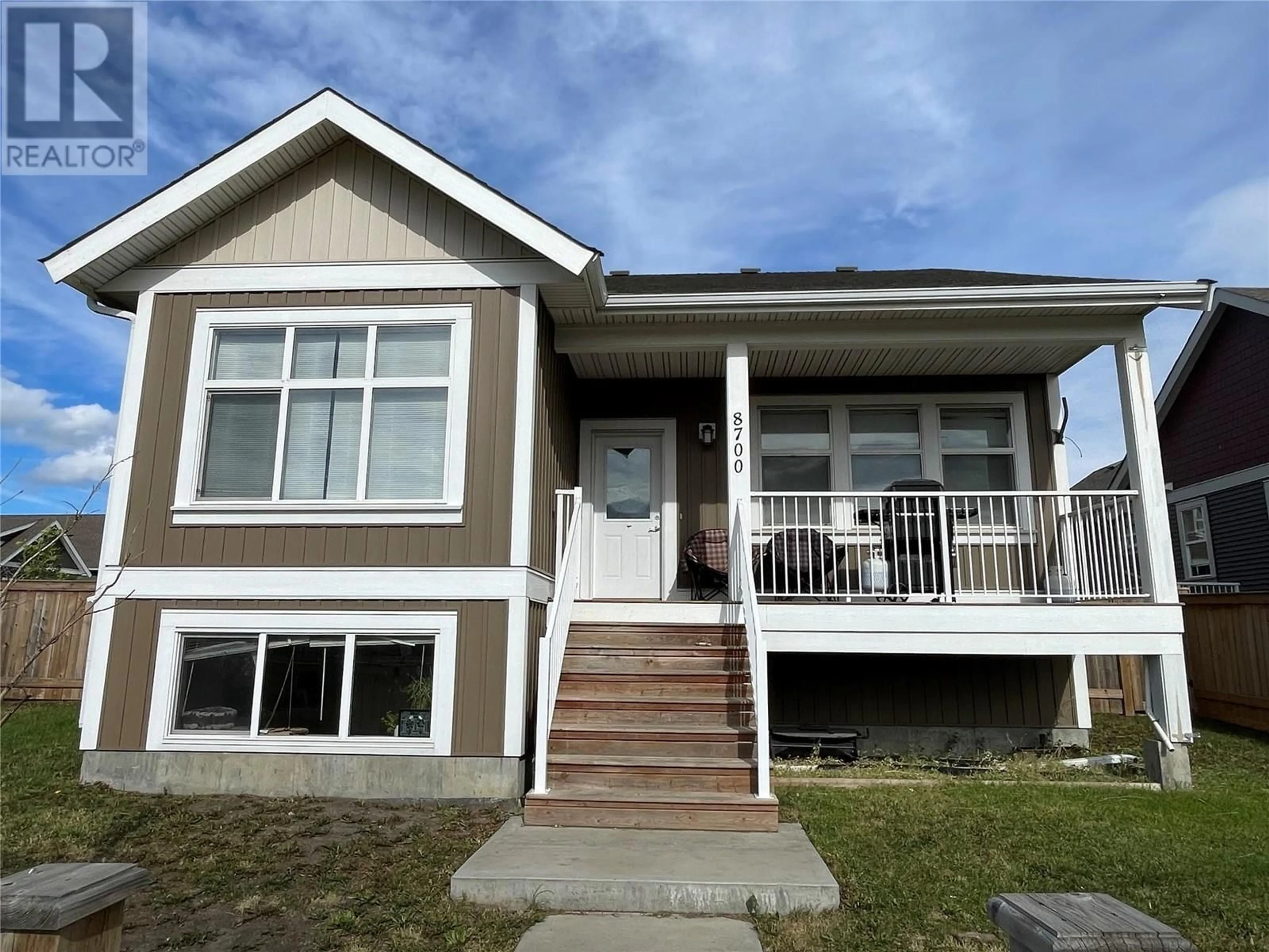 Home with vinyl exterior material, street for 8700 17 Street, Dawson Creek British Columbia V1G0H1