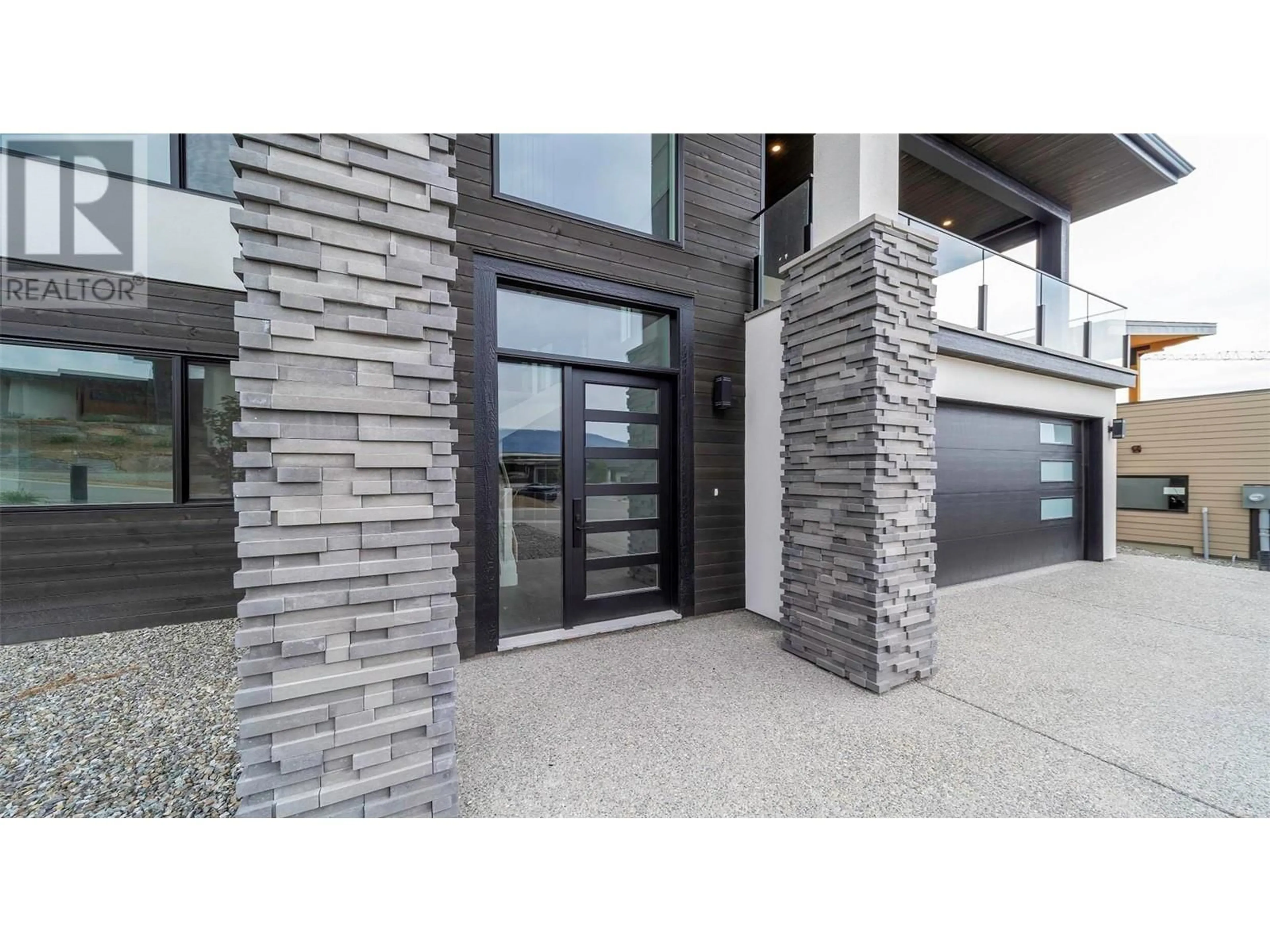 Home with brick exterior material, street for 9723 Centrestone Drive, Lake Country British Columbia V4V0A5