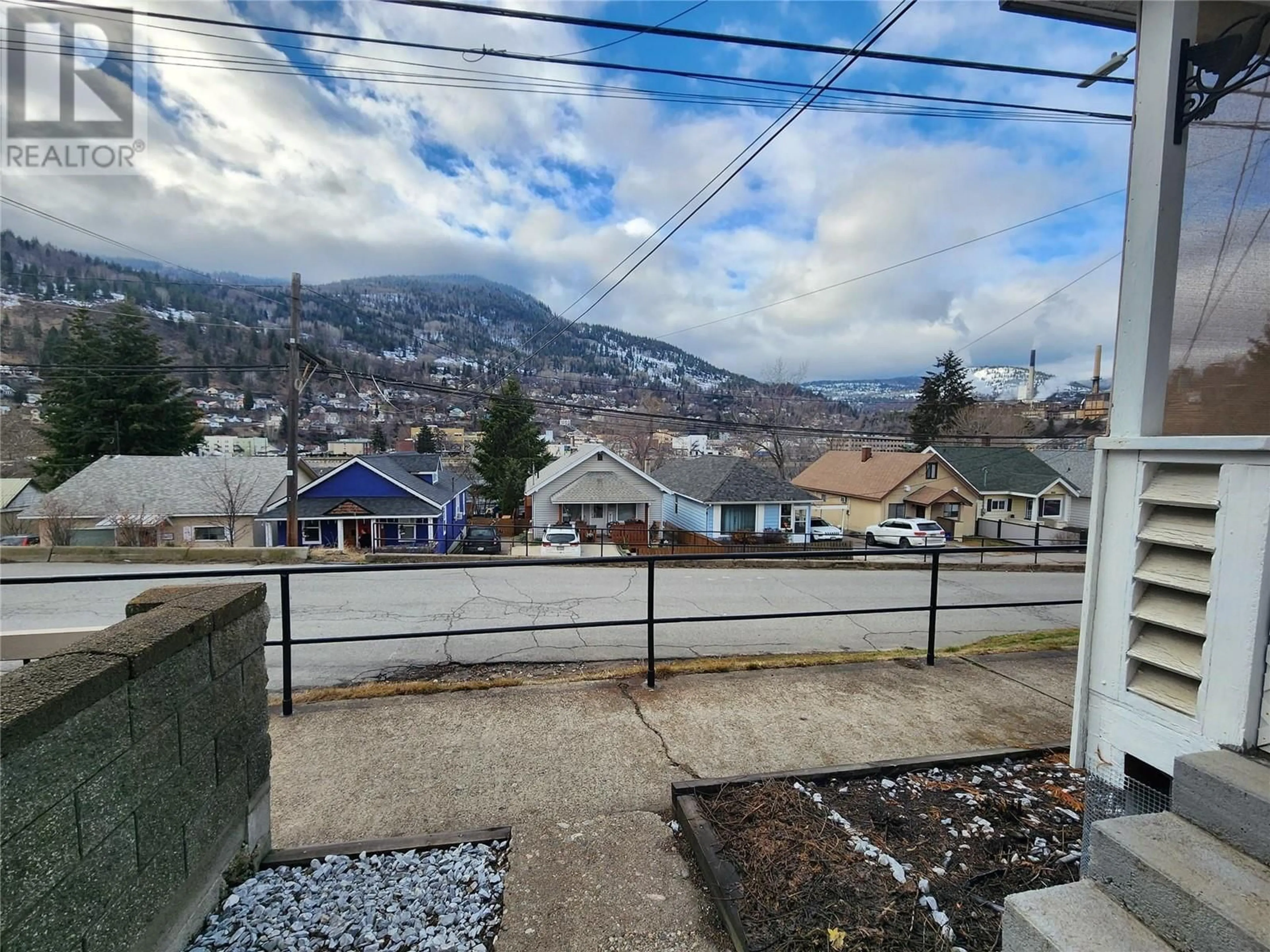 A pic from outside/outdoor area/front of a property/back of a property/a pic from drone, mountain view for 1649 COLUMBIA Avenue, Trail British Columbia V1R1K3