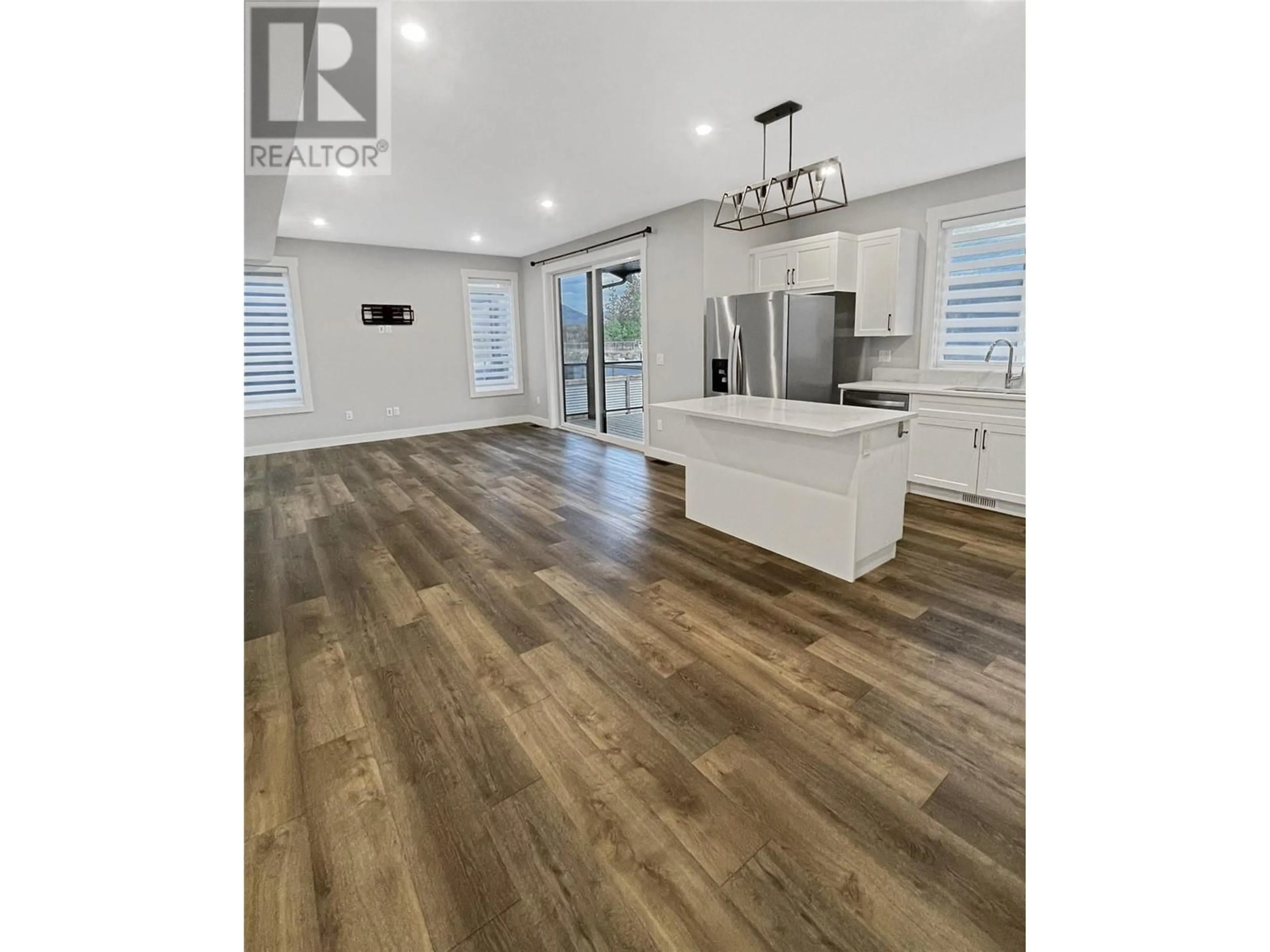 Open concept kitchen, wood/laminate floor for 110 Abbey Road, Princeton British Columbia V0X1W0