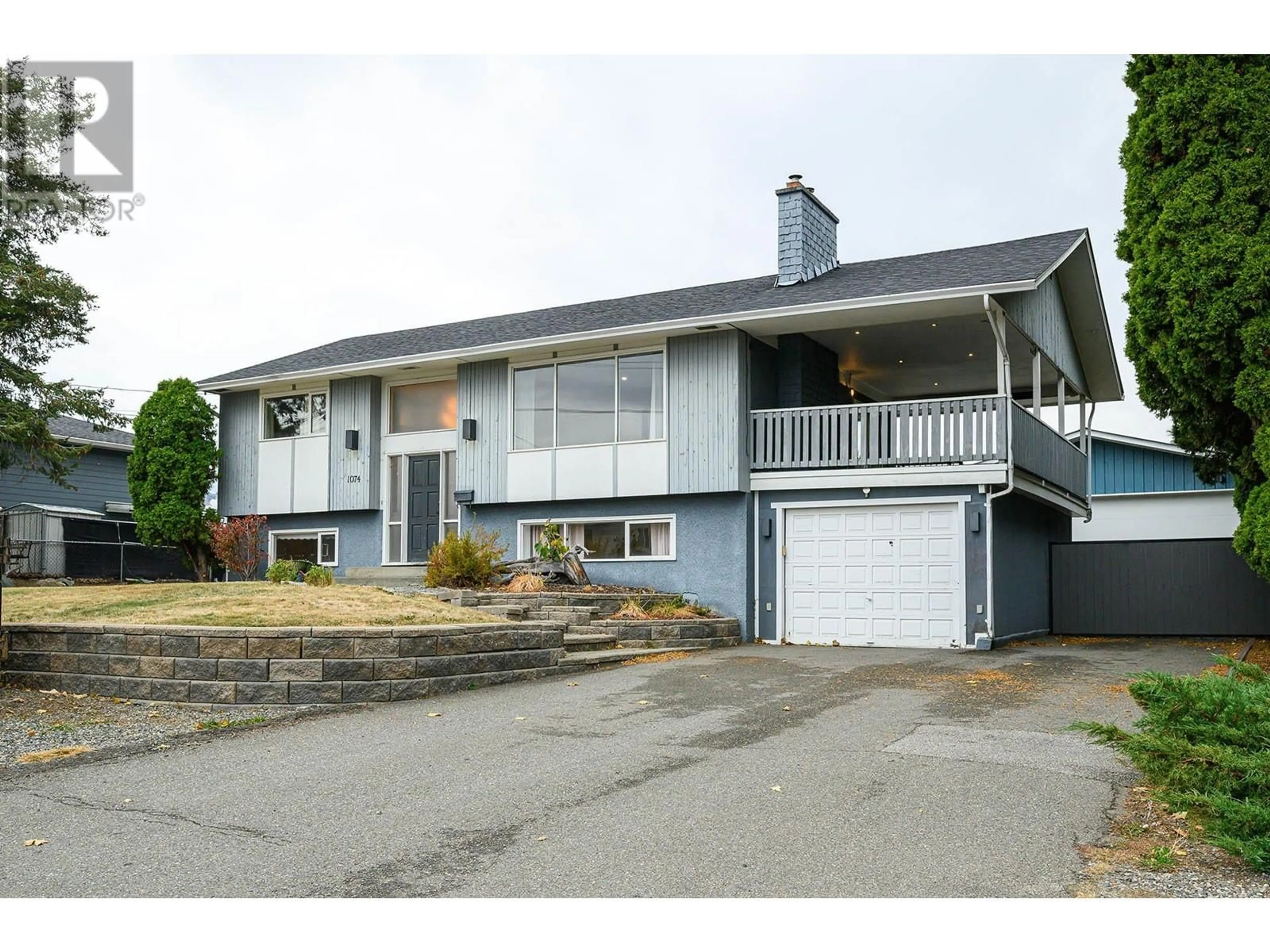 Home with vinyl exterior material, street for 1074 Ollek Street, Kamloops British Columbia V2B5B2