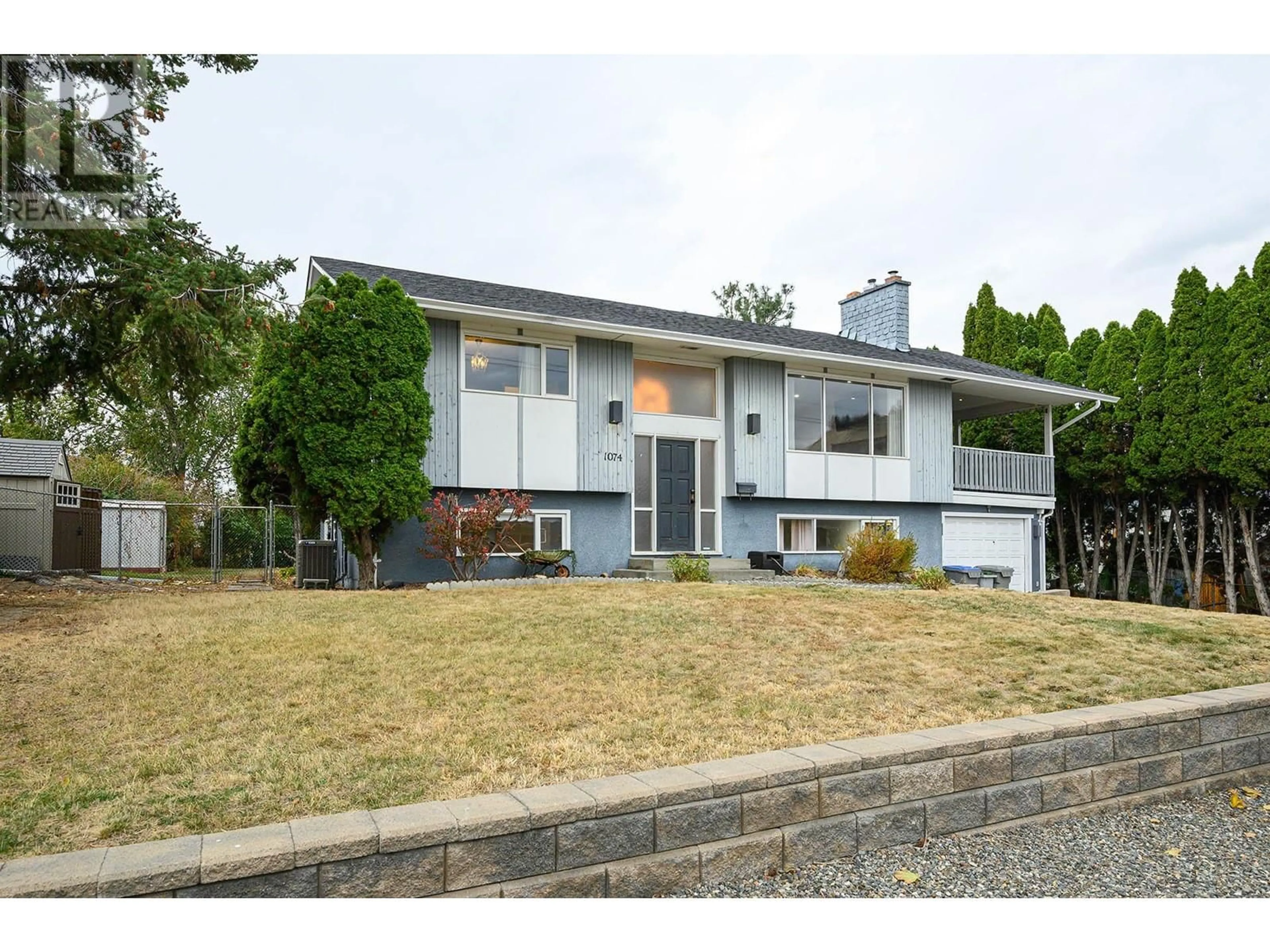 Home with vinyl exterior material, street for 1074 Ollek Street, Kamloops British Columbia V2B5B2