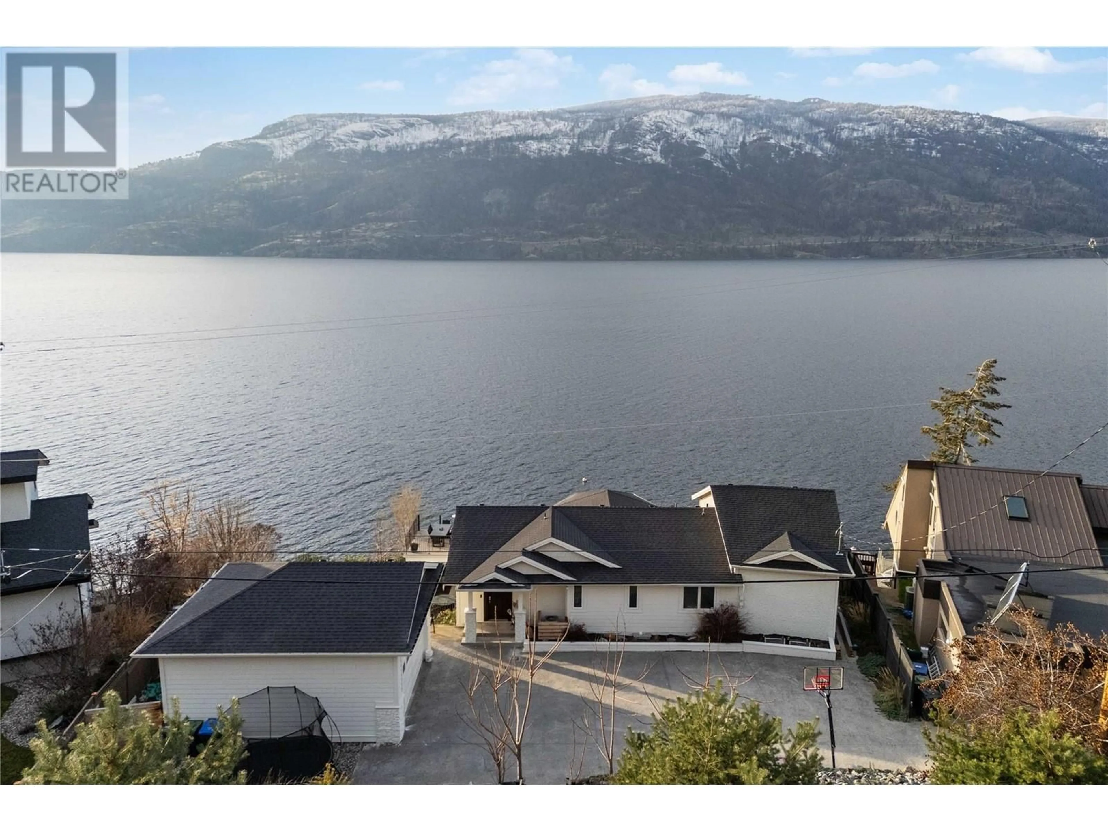 A pic from outside/outdoor area/front of a property/back of a property/a pic from drone, water/lake/river/ocean view for 1876 Dewdney Road, Kelowna British Columbia V1V2C3