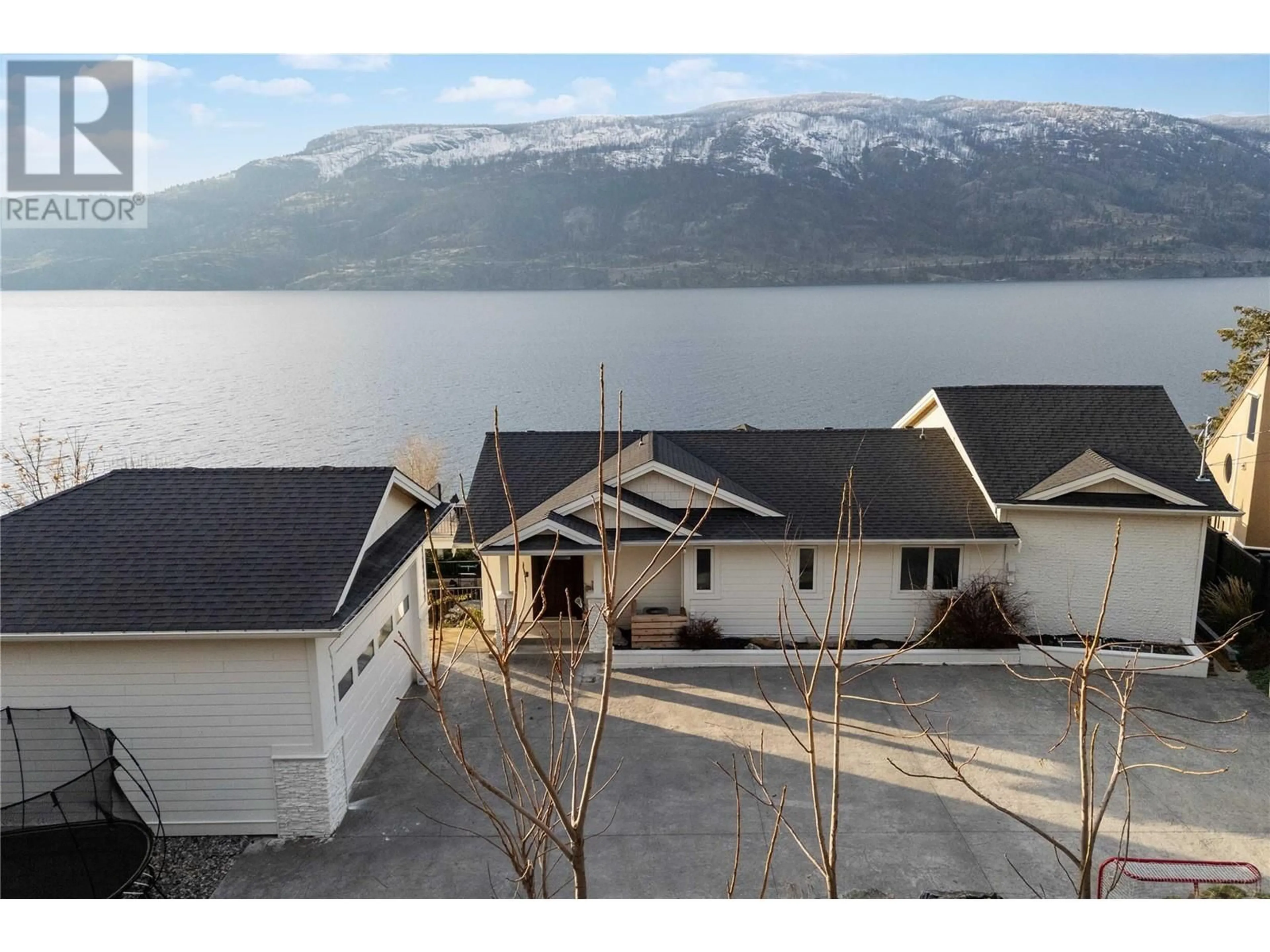 A pic from outside/outdoor area/front of a property/back of a property/a pic from drone, water/lake/river/ocean view for 1876 Dewdney Road, Kelowna British Columbia V1V2C3