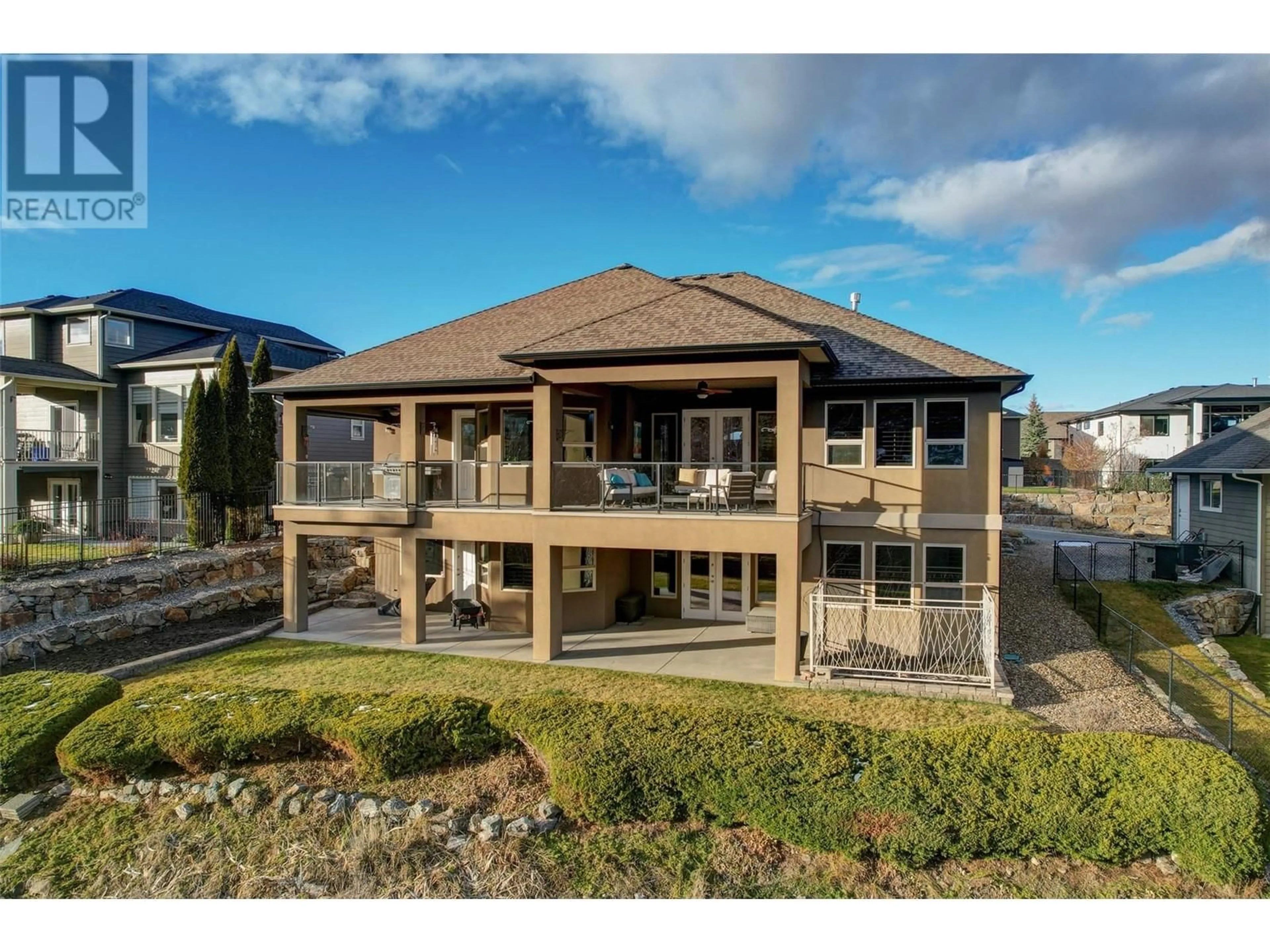 A pic from outside/outdoor area/front of a property/back of a property/a pic from drone, water/lake/river/ocean view for 475 Swan Drive, Kelowna British Columbia V1W5J5